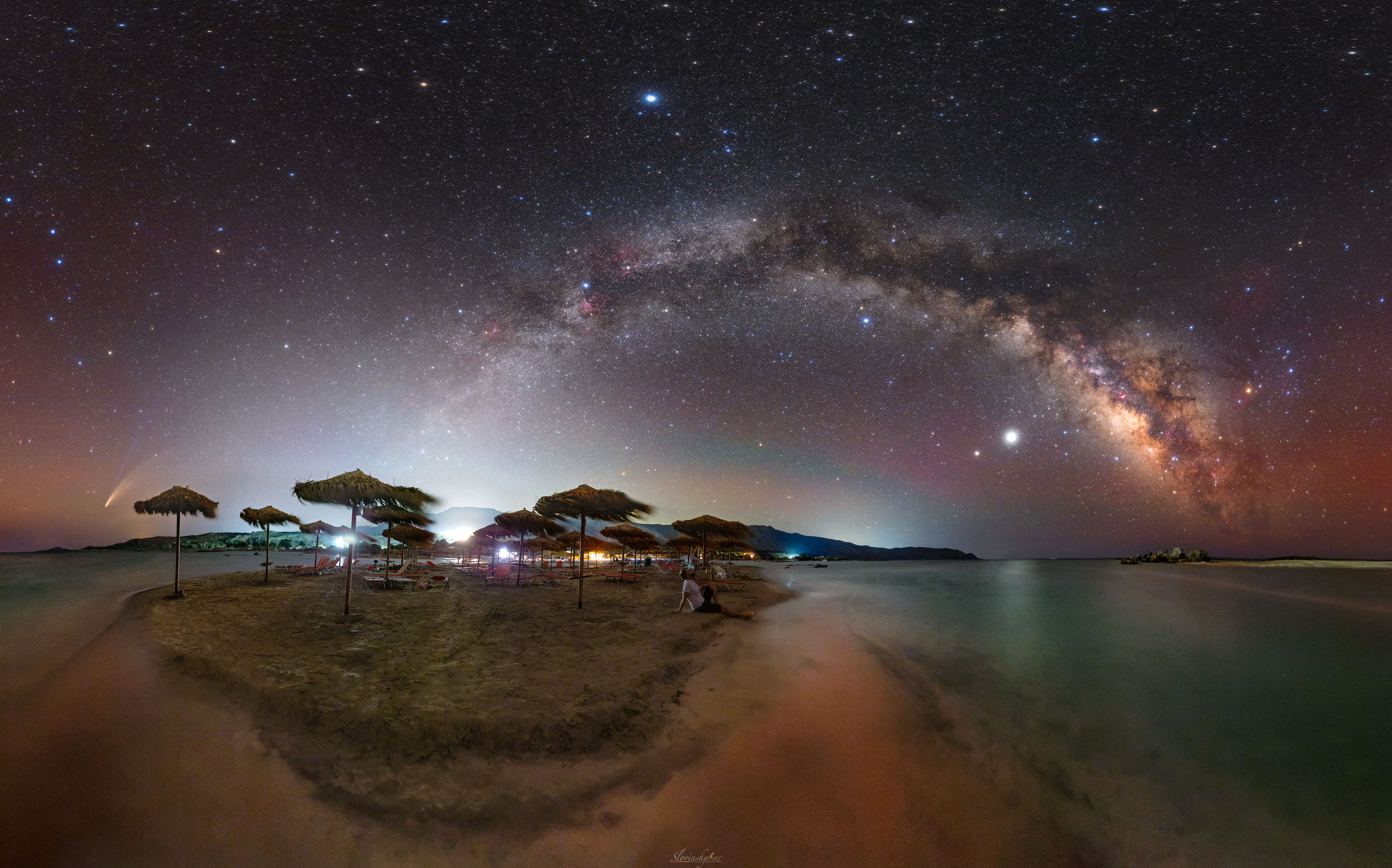 The month was July, the place was the Greek island of Crete, and the sky was spectacular. Of course there were the usual stars like Polaris, Vega, and Antares -- and that common asterism everyone knows: the Big Dipper. But this sky was just getting started.  The band of the Milky Way Galaxy stunned as it arched across the night like a bridge made of stars and dust but dotted with red nebula like candy. The planets Saturn and Jupiter were so bright you wanted to stop people on the beach and point them out. The air glowed like a rainbow -- but what really grabbed the glory was a comet. Just above the northern horizon, Comet NEOWISE spread its tails like nothing you had ever seen before or might ever see again.  Staring in amazement, there was only one thing to do: take a picture.   Coverage: NASA's SpaceX Crew-1 Mission