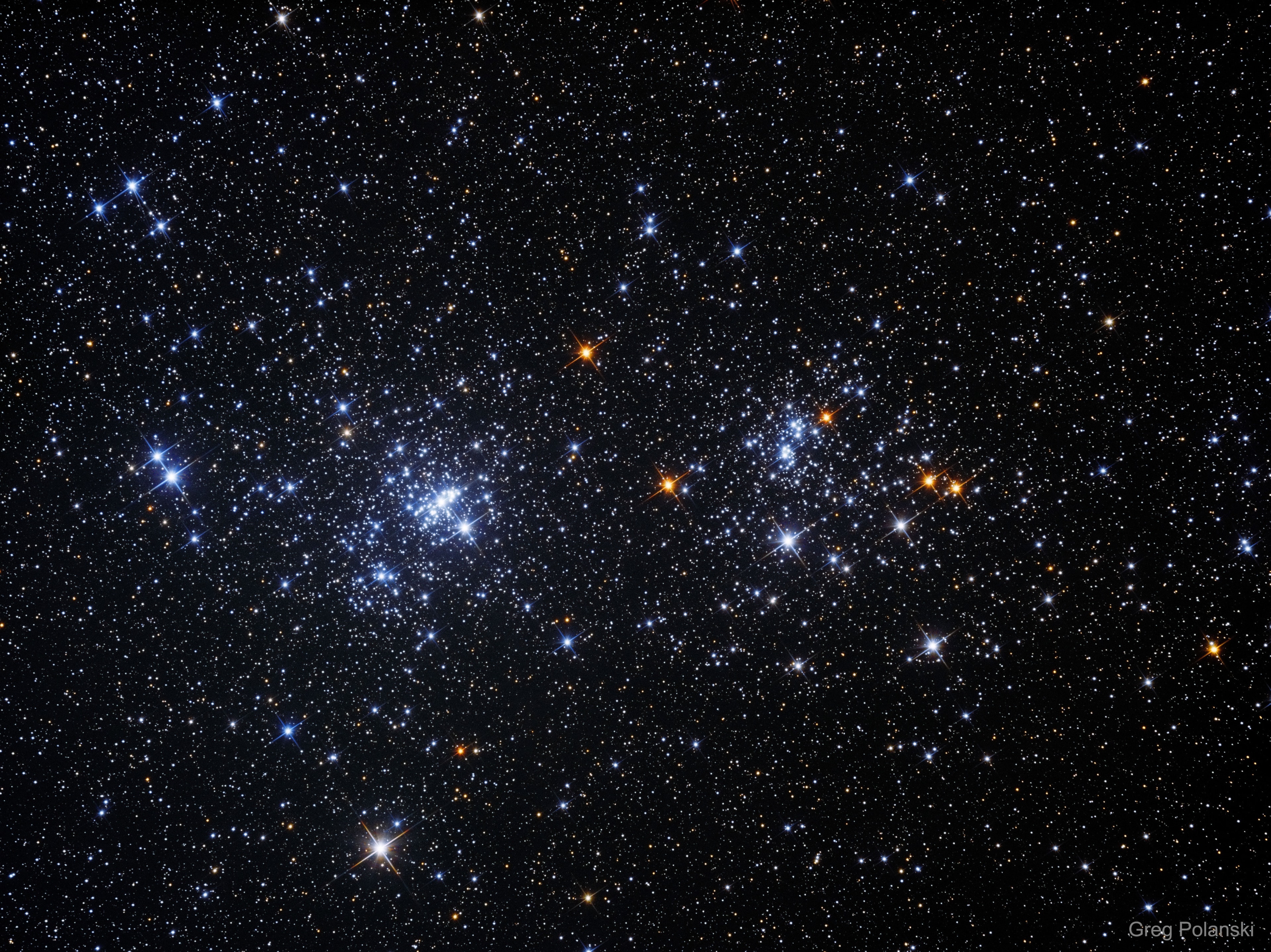 Most star clusters are singularly impressive.  Open clusters NGC 869 and NGC 884, however, could be considered doubly impressive.  Also known as "h and chi Persei", this unusual double cluster, shown above, is bright enough to be seen from a dark location without even binoculars.  Although their discovery surely predates recorded history, the Greek astronomer Hipparchus notably cataloged the double cluster.  The clusters are over 7,000 light years distant toward the constellation of Perseus, but are separated by only hundreds of light years. In addition to being physically close together, the clusters' ages based on their individual stars are similar - evidence that both clusters were likely a product of the same star-forming region.