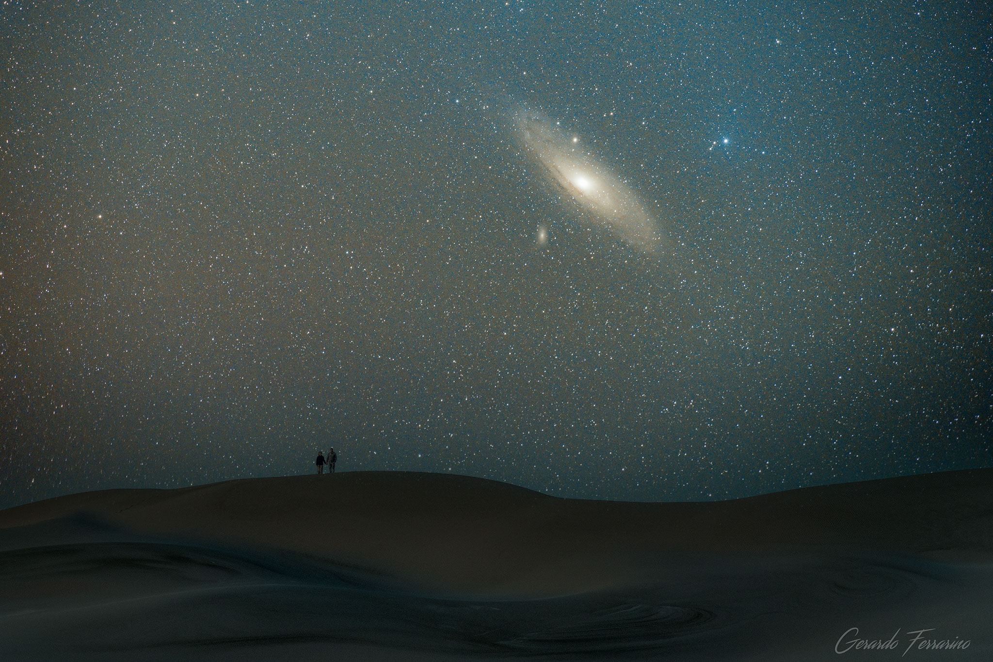 How far can you see?  The Andromeda Galaxy at 2.5 million light years away is the most distant object easily seen with your unaided eye.  Most other apparent denizens of the night sky -- stars, clusters, and nebulae -- typically range from a few hundred to a few thousand light-years away and lie well within our own Milky Way Galaxy.  Given its distance, light from Andromeda is likely also the oldest light that you can see.  Also known as M31, the Andromeda Galaxy dominates the center of the featured zoomed image, taken from the dunes of Bahía Creek, Patagonia, in southern Argentina.  The image is a combination of 45 background images with one foreground image -- all taken with the same camera and from the same location within 90 minutes.  M110, a satellite galaxy of Andromenda is visible just below and to the left of M31's core. As cool as it may be to see this neighboring galaxy to our Milky Way with your own eyes, long duration camera exposures can pick up many faint and breathtaking details.  Recent data indicates that our Milky Way Galaxy will collide and combine with the similarly-sized Andromeda galaxy in a few billion years.