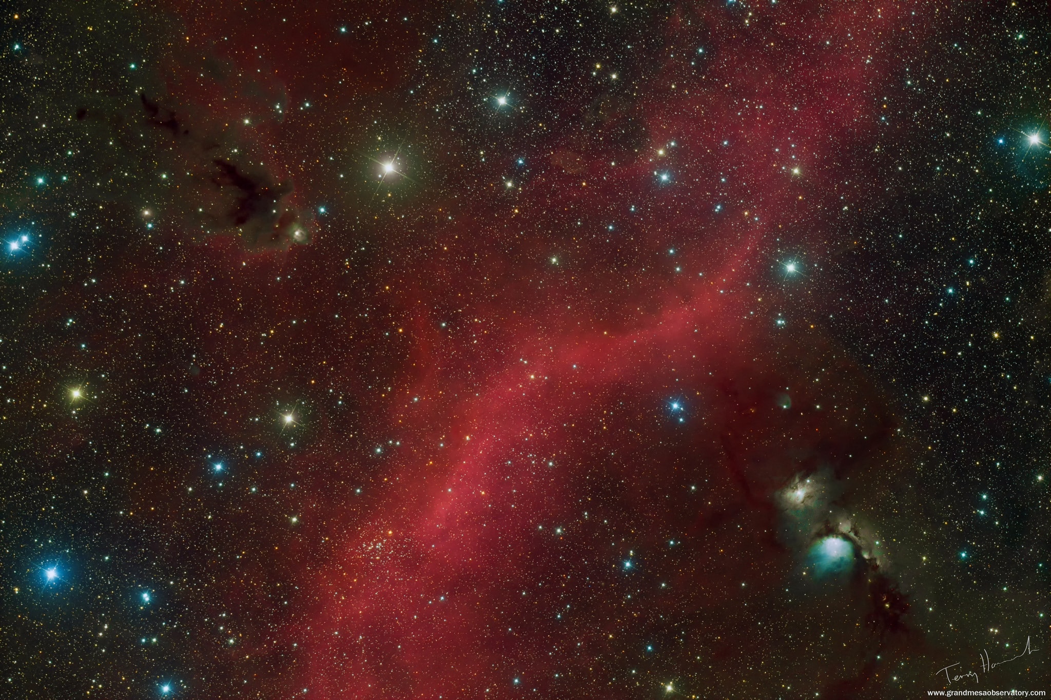 Bright stars, interstellar clouds of dust and glowing nebulae fill this cosmic scene, a skyscape just north of Orion's belt. Close to the plane of our Milky Way Galaxy, the wide field view spans just under 5 degrees or about 10 full moons on the sky. Striking bluish M78, a reflection nebula, is at the lower right. M78's tint is due to dust preferentially reflecting the blue light of hot, young stars. In colorful contrast, the red swath of glowing hydrogen gas streaming through the center is part of the region's faint but extensive emission nebula known as Barnard's Loop. At upper left, a dark dust cloud forms a prominent silhouette cataloged as LDN 1622. While M78 and the complex Barnard's Loop are some 1,500 light-years away, LDN 1622 is likely to be much closer, only about 500 light-years distant from our fair planet Earth.