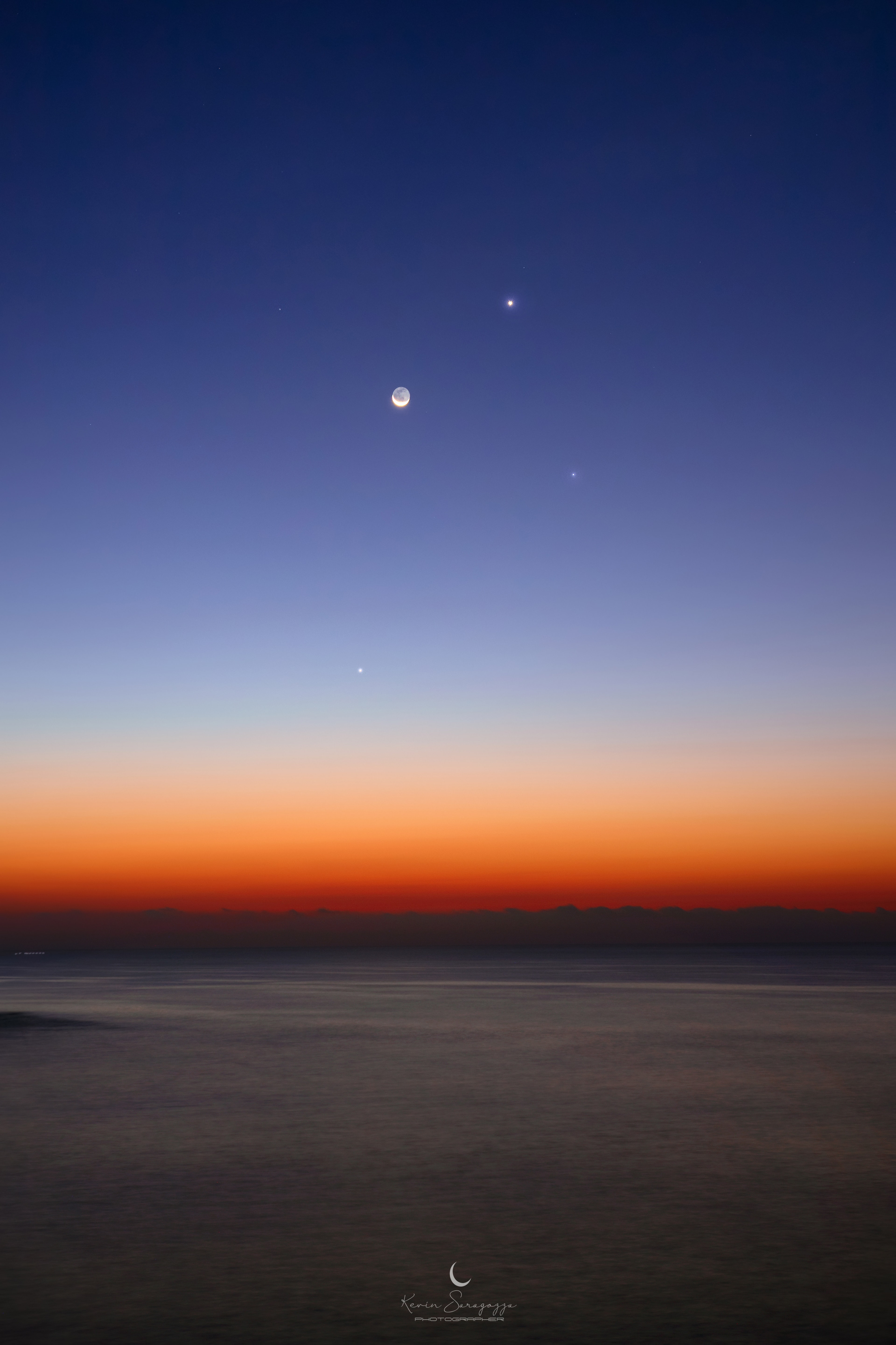Yesterday, early morning risers around planet Earth were treated to a waning Moon low in the east as the sky grew bright before dawn. From the Island of Ortigia, Syracuse, Sicily, Italy this simple snapshot found the slender sunlit crescent just before sunrise. Never wandering far from the Sun in Earth's sky, inner planets Venus and Mercury shared the calm seaside view. Also in the frame, right of the line-up of Luna and planets, is bright star Spica, alpha star of the constellation Virgo and one of the 20 brightest stars in Earth's night. Tomorrow the Moon will be New. The dark lunar disk means mostly dark nights for planet Earth in the coming week and a good chance to watch the annual Leonid Meteor Shower.