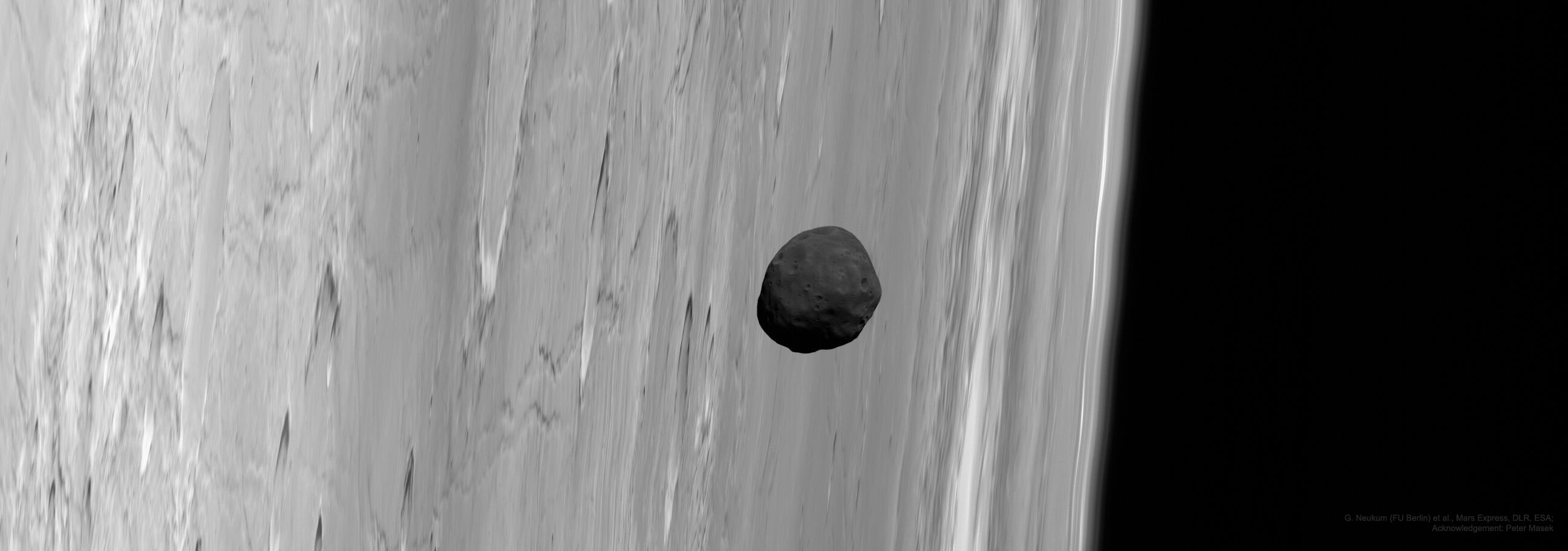 Why is Phobos so dark?  Phobos, the largest and innermost of two Martian moons, is the darkest moon in the entire Solar System.  Its unusual orbit and color indicate that it may be a captured asteroid composed of a mixture of ice and dark rock.  The featured picture of Phobos near the limb of Mars was captured in 2010 by the robot spacecraft Mars Express currently orbiting Mars.  Phobos is a heavily cratered and barren moon, with its largest crater located on the far side.  From images like this, Phobos has been determined to be covered by perhaps a meter of loose dust.  Phobos orbits so close to Mars that from some places it would appear to rise and set twice a day, but from other places it would not be visible at all.  Phobos' orbit around Mars is continually decaying -- it will likely break up with pieces crashing to the Martian surface in about 50 million years.