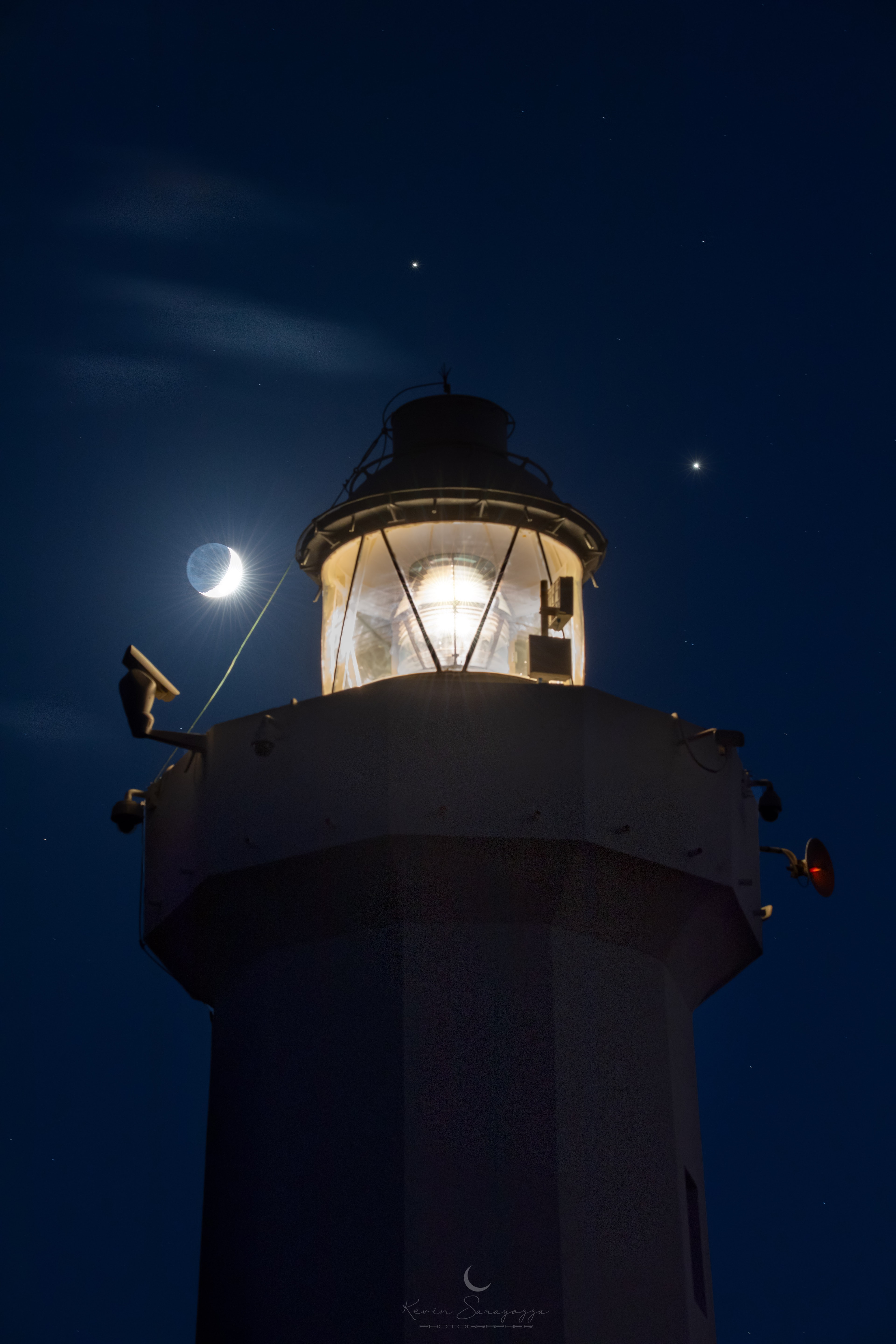 Don’t miss the coming great conjunction. In just under two weeks, the two largest planets in our Solar System will angularly pass so close together in Earth's sky that the Moon would easily be able to cover them both simultaneously.  This pending planetary passage -- on December 21 -- will be the closest since 1623.  Jupiter and Saturn will remain noticeably bright and can already be seen together toward the southwest just after sunset.  Soon after dusk is the best time to see them -- because they set below the horizon soon after.  In mid-November, the Jovian giants were imaged together here about three degrees apart -- and slowly closing. The featured image, including a crescent moon, captured the dynamic duo beyond the Cape Murro di Porco Lighthouse in Syracuse, Sicily, Italy.