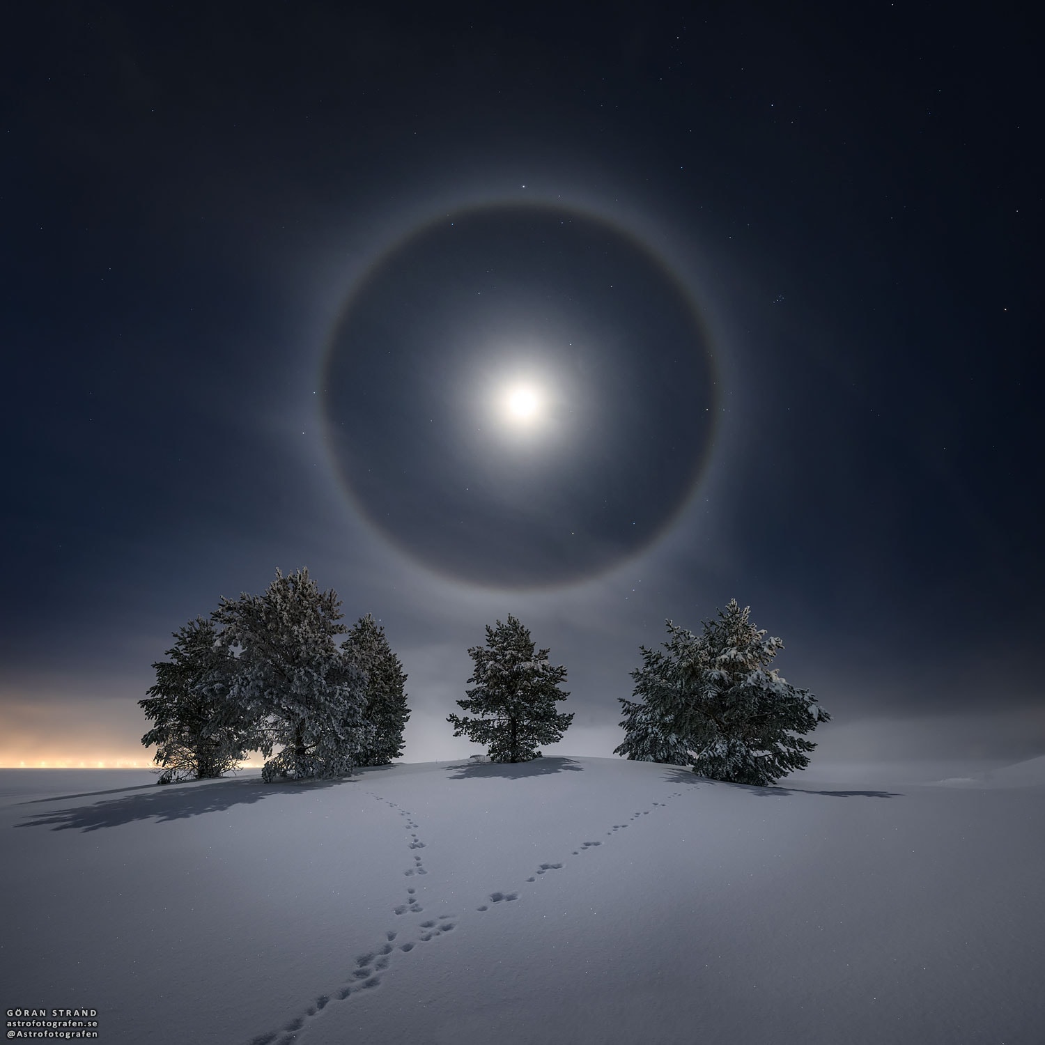 Have you ever seen a halo around the Moon?  This fairly common sight occurs when high thin clouds containing millions of tiny ice crystals cover much of the sky.  Each ice crystal acts like a miniature lens.  Because most of the crystals have a similar elongated hexagonal shape, light entering one crystal face and exiting through the opposing face refracts 22 degrees, which corresponds to the radius of the Moon Halo.  A similar Sun Halo may be visible during the day.  Exactly how ice-crystals form in clouds remains a topic of research. In the featured image taken last week from Östersund, Sweden, a complete lunar halo was captured over snowy trees and rabbit tracks.   APOD is available via Instagram: in English, Indonesian, Persian, and Portuguese