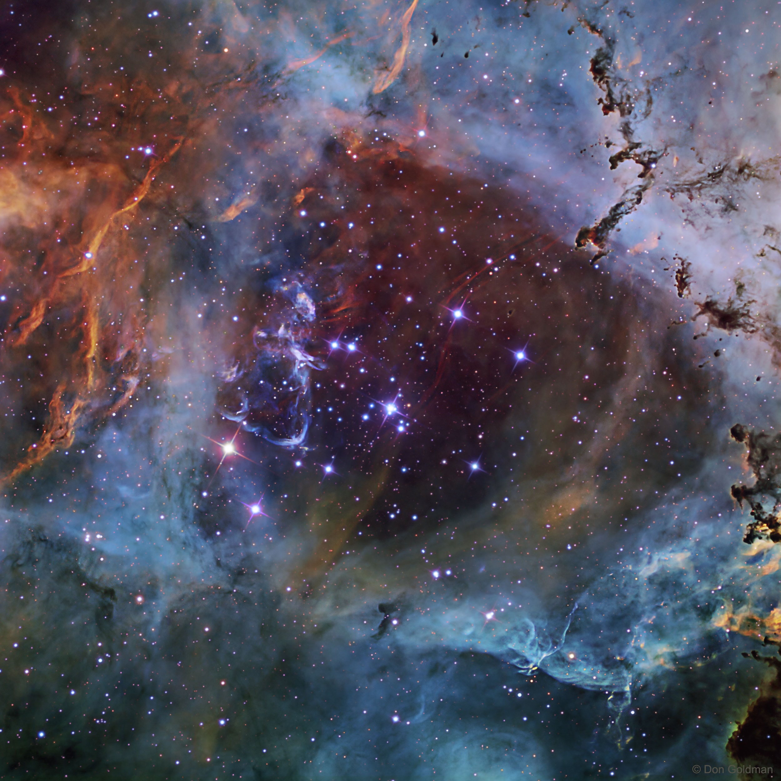 In the heart of the Rosette Nebula lies a bright open cluster of stars that lights up the nebula.  The stars of NGC 2244 formed from the surrounding gas only a few million years ago.  The featured image taken in January using multiple exposures and very specific colors of Sulfur (shaded red), Hydrogen (green), and Oxygen (blue), captures the central region in tremendous detail. A hot wind of particles streams away from the cluster stars and contributes to an already complex menagerie of gas and dust filaments while slowly evacuating the cluster center.  The Rosette Nebula's center measures about 50 light-years across, lies about 5,200 light-years away, and is visible with binoculars towards the constellation of the Unicorn (Monoceros).