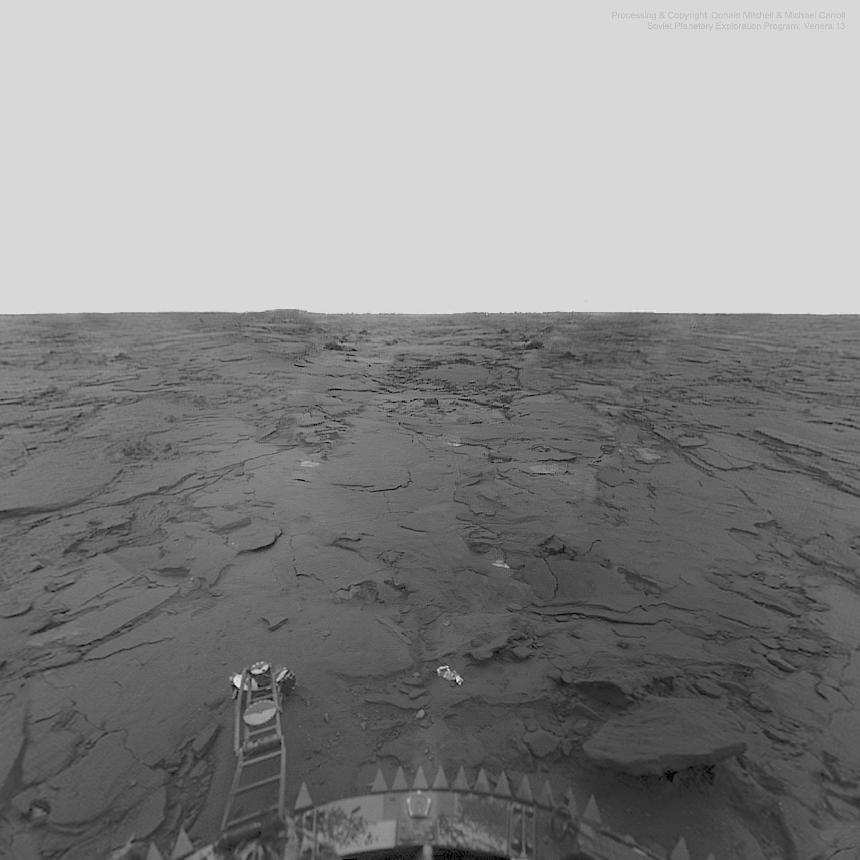 If you could stand on Venus -- what would you see?  Pictured is the view from Venera 14, a robotic Soviet lander which parachuted and air-braked down through the thick Venusian atmosphere in March of 1982. The desolate landscape it saw included flat rocks, vast empty terrain, and a featureless sky above Phoebe Regio near Venus' equator. On the lower left is the spacecraft's penetrometer used to make scientific measurements, while the light piece on the right is part of an ejected lens-cap.  Enduring temperatures near 450 degrees Celsius and pressures 75 times that on Earth, the hardened Venera spacecraft lasted only about an hour. Although data from Venera 14 was beamed across the inner Solar System almost 40 years ago, digital processing and merging of Venera's unusual images continues even today.  Recent analyses of infrared measurements taken by ESA's orbiting Venus Express spacecraft indicate that active volcanoes may currently exist on Venus.