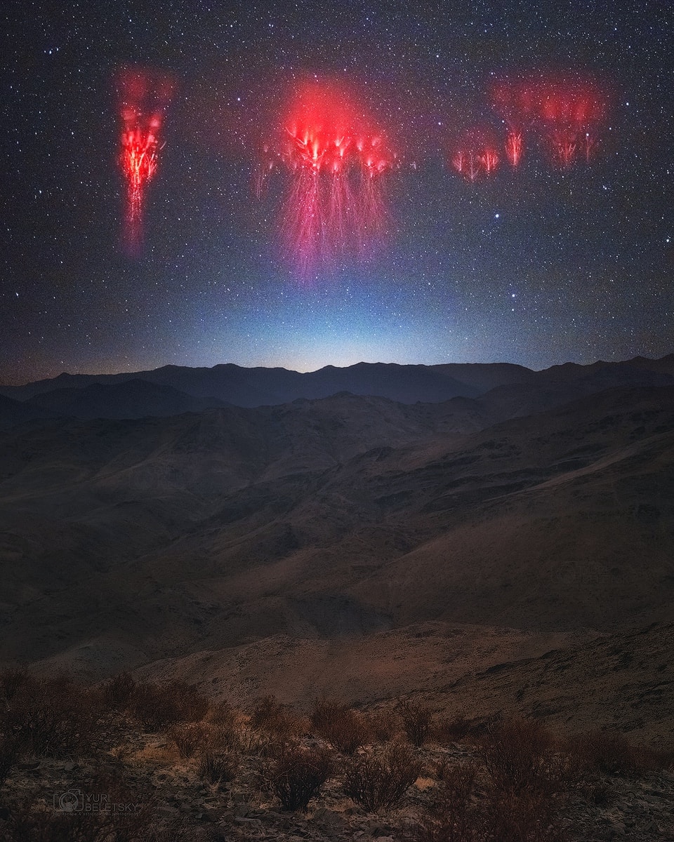 What are those red filaments in the sky? They are a rarely seen form of lightning confirmed only about 30 years ago: red sprites. Recent research has shown that following a powerful positive cloud-to-ground lightning strike, red sprites may start as 100-meter balls of ionized air that shoot down from about 80-km high at 10 percent the speed of light. They are quickly followed by a group of upward streaking ionized balls. The featured image was taken earlier this year from Las Campanas observatory in Chile over the Andes Mountains in Argentina. Red sprites take only a fraction of a second to occur and are best seen when powerful thunderstorms are visible from the side.    APOD via Instagram in: English, Indonesian, Persian, and Portuguese