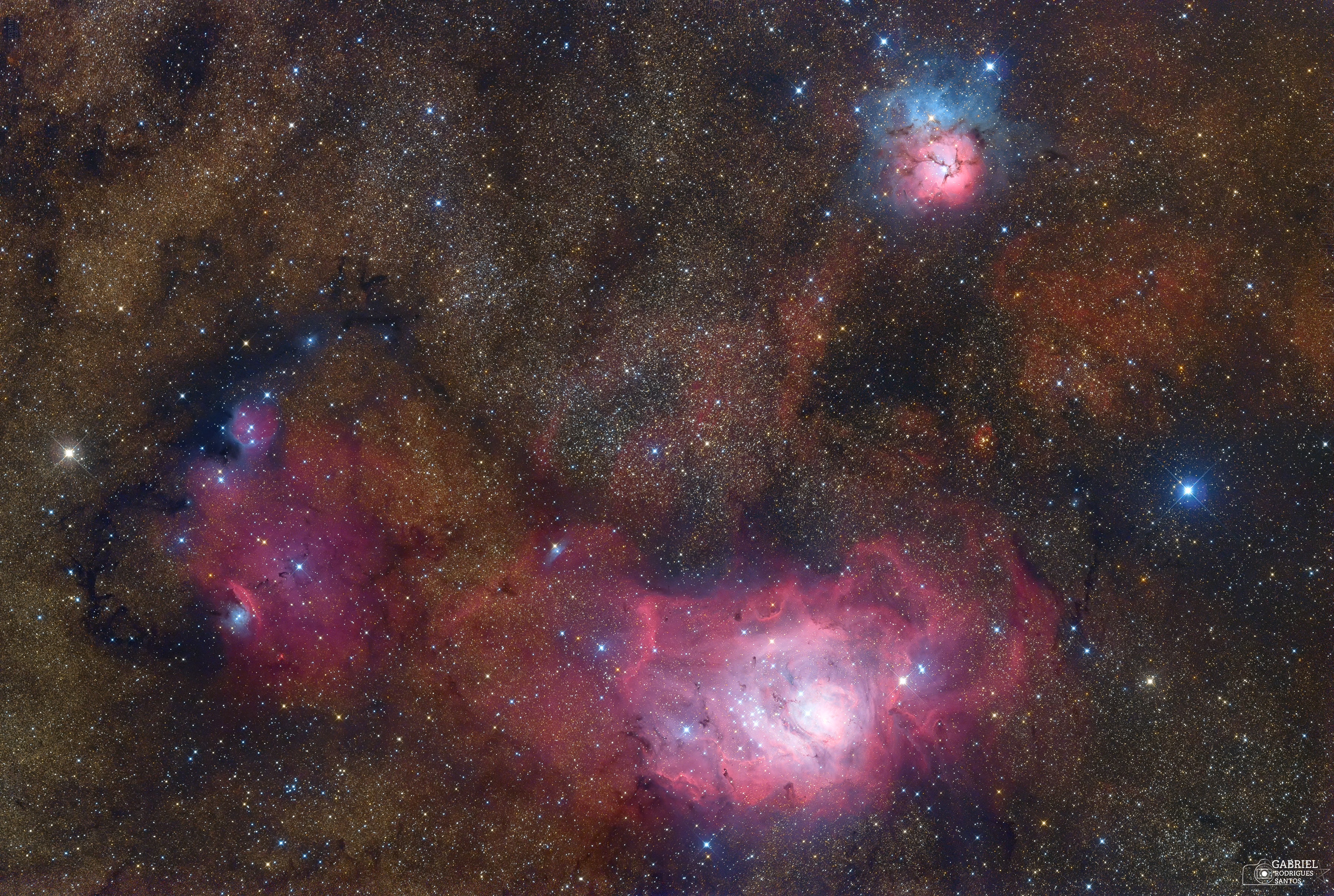 These three bright nebulae are often featured on telescopic tours of the constellation Sagittarius and the crowded starfields of the central Milky Way. In fact, 18th century cosmic tourist Charles Messier cataloged two of them; M8, the large nebula below and right of center, and colorful M20 near the top of the frame. The third emission region includes NGC 6559, left of M8 and separated from the larger nebula by a dark dust lane. All three are stellar nurseries about five thousand light-years or so distant. Over a hundred light-years across the expansive M8 is also known as the Lagoon Nebula. M20's popular moniker is the Trifid. Glowing hydrogen gas creates the dominant red color of the emission nebulae. But for striking contrast, blue hues in the Trifid are due to dust reflected starlight. The broad interstellarscape spans almost 4 degrees or 8 full moons on the sky.