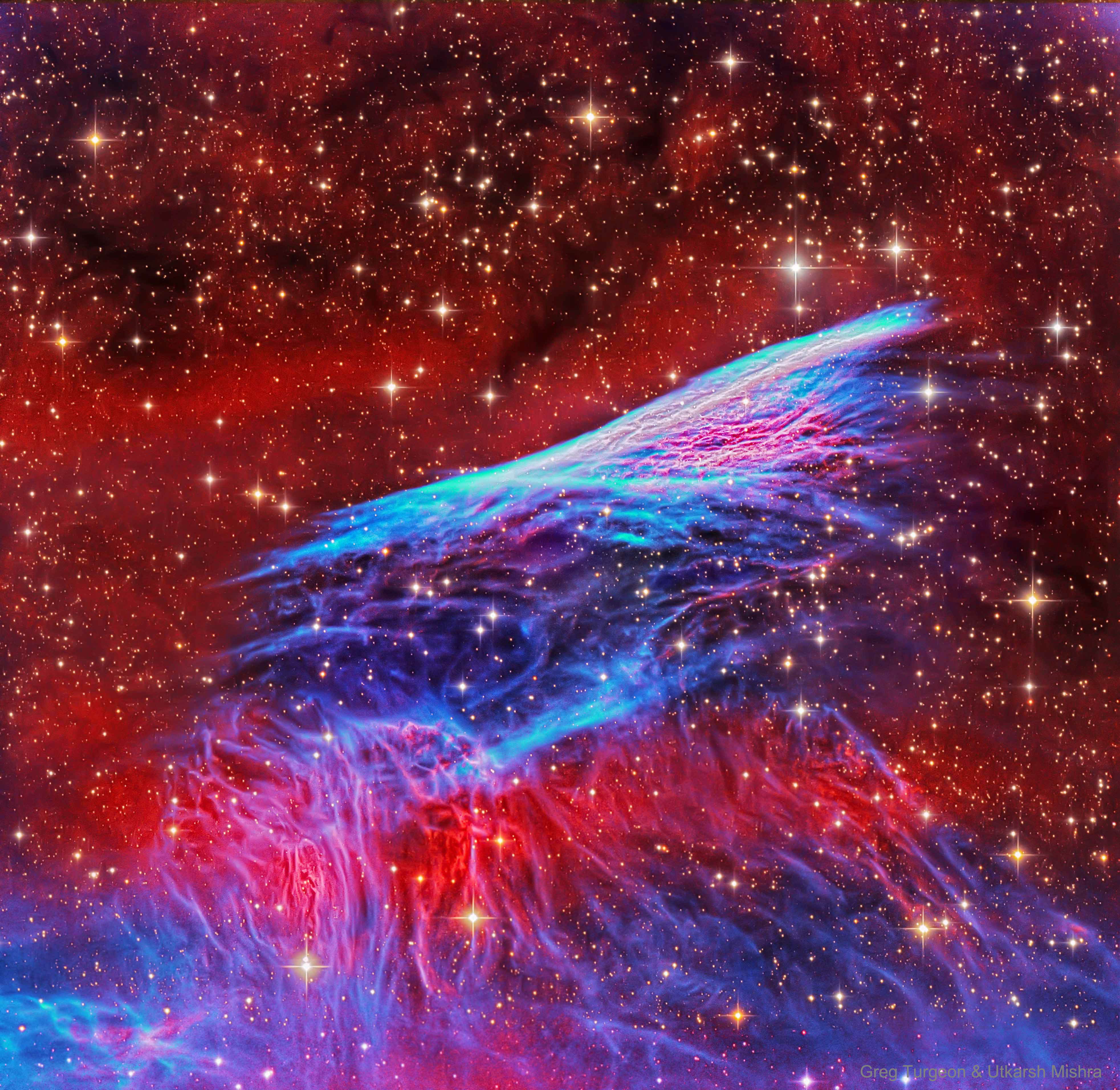 This supernova shock wave plows through interstellar space at over 500,000 kilometers per hour. Near the middle and moving up in this sharply detailed color composite, thin, bright, braided filaments are actually long ripples in a cosmic sheet of glowing gas seen almost edge-on. Cataloged as NGC 2736, its elongated appearance suggests its popular name, the Pencil Nebula. The Pencil Nebula is about 5 light-years long and 800 light-years away, but represents only a small part of the Vela supernova remnant. The Vela remnant itself is around 100 light-years in diameter, the expanding debris cloud of a star that was seen to explode about 11,000 years ago. Initially, the shock wave was moving at millions of kilometers per hour but has slowed considerably, sweeping up surrounding interstellar material. In the featured narrow-band, wide field image, red and blue colors track, primarily, the characteristic glows of ionized hydrogen and oxygen atoms, respectively.   Portal Universe: Random APOD Generator