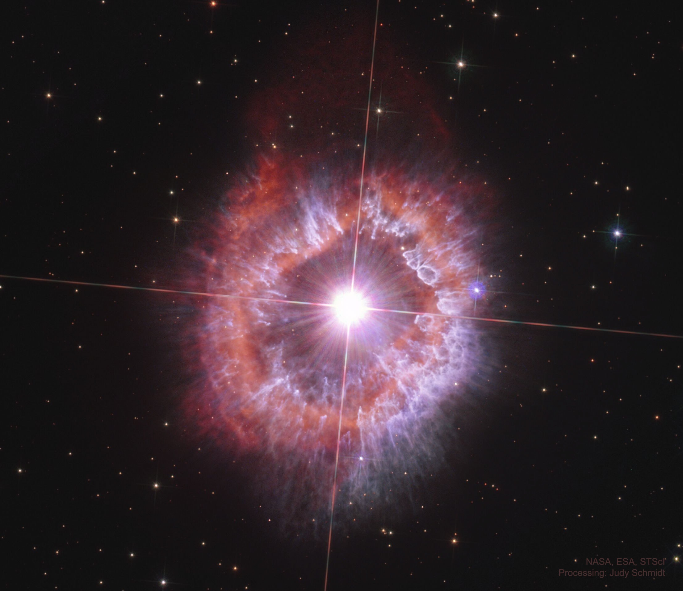 What created these unusual clouds?  At the center of this 2021 Hubble image, processed by Judy Schmidt, sits AG Carinae, a supergiant star located about 20,000 light-years away in the southern constellation Carina.  The star's emitted power is over a million times that of the Sun, making AG Carinae one of the most luminous stars in our Milky Way galaxy.  AG Carinae and its neighbor Eta Carinae belong to the scarce Luminous Blue Variable (LBV) class of stars, known for their rare but violent eruptions.  The nebula that surrounds AG Car is interpreted as a remnant of one or more such outbursts.  This nebula measures 5 light-years across, is estimated to contain about 10 solar masses of gas, and to be at least 10,000 years old.  This Hubble image, taken to commemorate Hubble's 31st launch anniversary, is the first to capture the whole nebula, offering a new perspective on its structure and dust content.  The LBVs represent a late and short stage in the lives of some supergiant stars, but explaining their restlessness remains a challenge to humanity's understanding of how massive stars work.