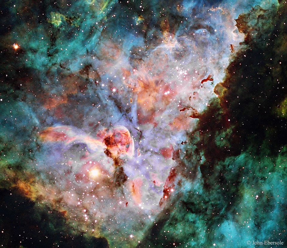 What forms lurk in the mists of the Carina Nebula? The dark ominous figures are actually molecular clouds, knots of molecular gas and dust so thick they have become opaque.  In comparison, however,  these clouds are typically much less dense than Earth's atmosphere.  Featured here is a detailed image of the core of the Carina Nebula, a part where both dark and colorful clouds of gas and dust are particularly prominent.  The image was captured in mid-2016 from Siding Spring Observatory in Australia.  Although the nebula is predominantly composed of hydrogen gas -- here colored green, the image was assigned colors so that light emitted by trace amounts of sulfur and oxygen appear red and blue, respectively.  The entire Carina Nebula, cataloged as NGC 3372, spans over 300 light years and lies about 7,500 light-years away in the constellation of Carina. Eta Carinae, the most energetic star in the nebula, was one of the brightest stars in the sky in the 1830s, but then faded dramatically.