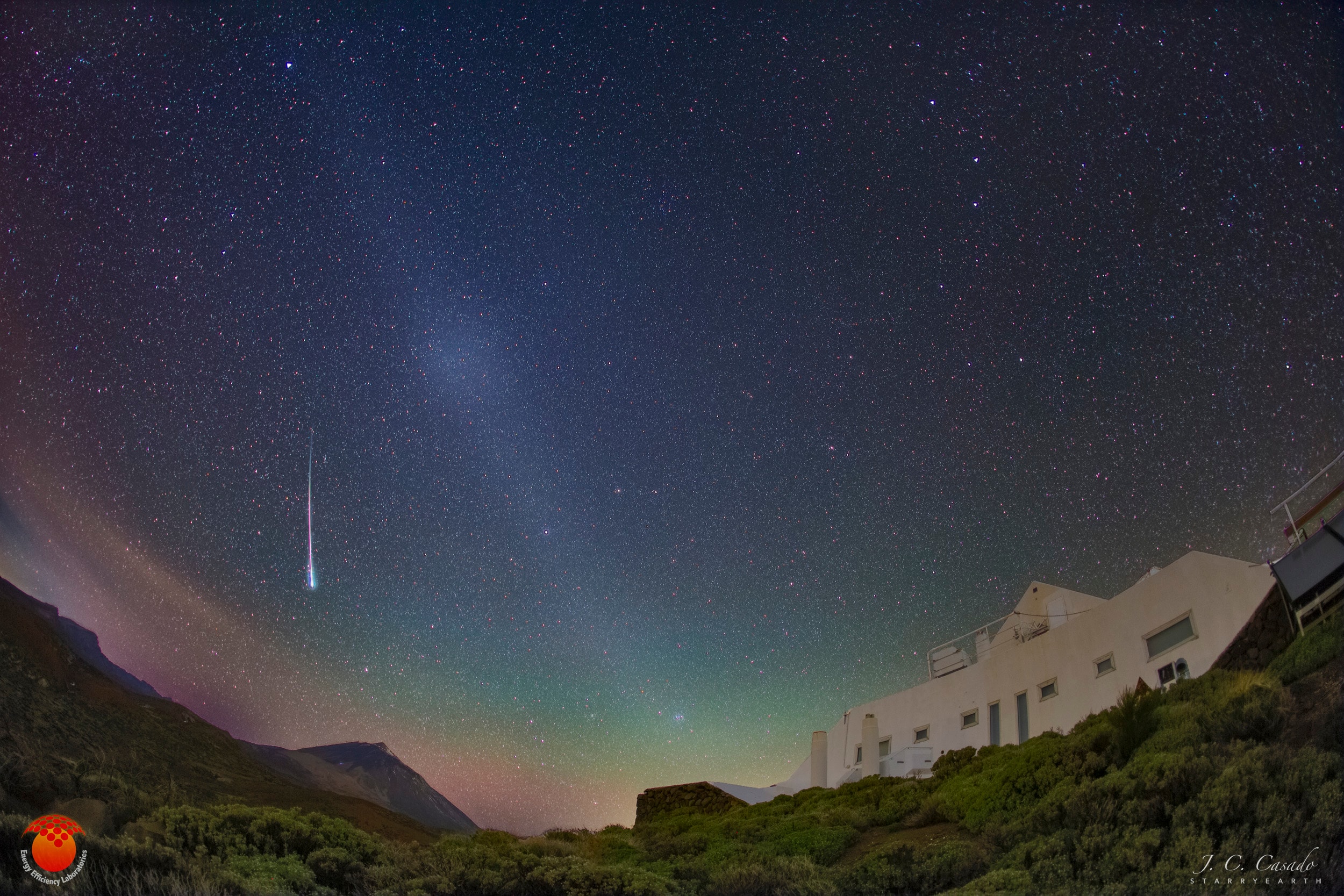 Is the night sky darkest in the direction opposite the Sun? No. In fact, a rarely discernable faint glow known as the gegenschein (German for "counter glow") can be seen 180 degrees around from the Sun in an extremely  dark sky. The gegenschein is sunlight back-scattered off small interplanetary dust particles.  These dust particles are millimeter sized splinters from asteroids and orbit in the ecliptic plane of the planets.  Pictured here from last March is one of the more spectacular pictures of the gegenschein yet taken. The deep exposure of an extremely dark sky over Teide Observatory in Spain's Canary Islands shows the gegenschein as part of extended zodiacal light.  Notable background objects include a bright meteor (on the left), the Big Dipper (top right), and Polaris (far right).  The meteor nearly points toward Mount Teide, Spain's highest mountain, while the Pyramid solar laboratory is visible on the right.  During the day, a phenomenon like the gegenschein called the glory can be seen in reflecting air or clouds opposite the Sun from an airplane.