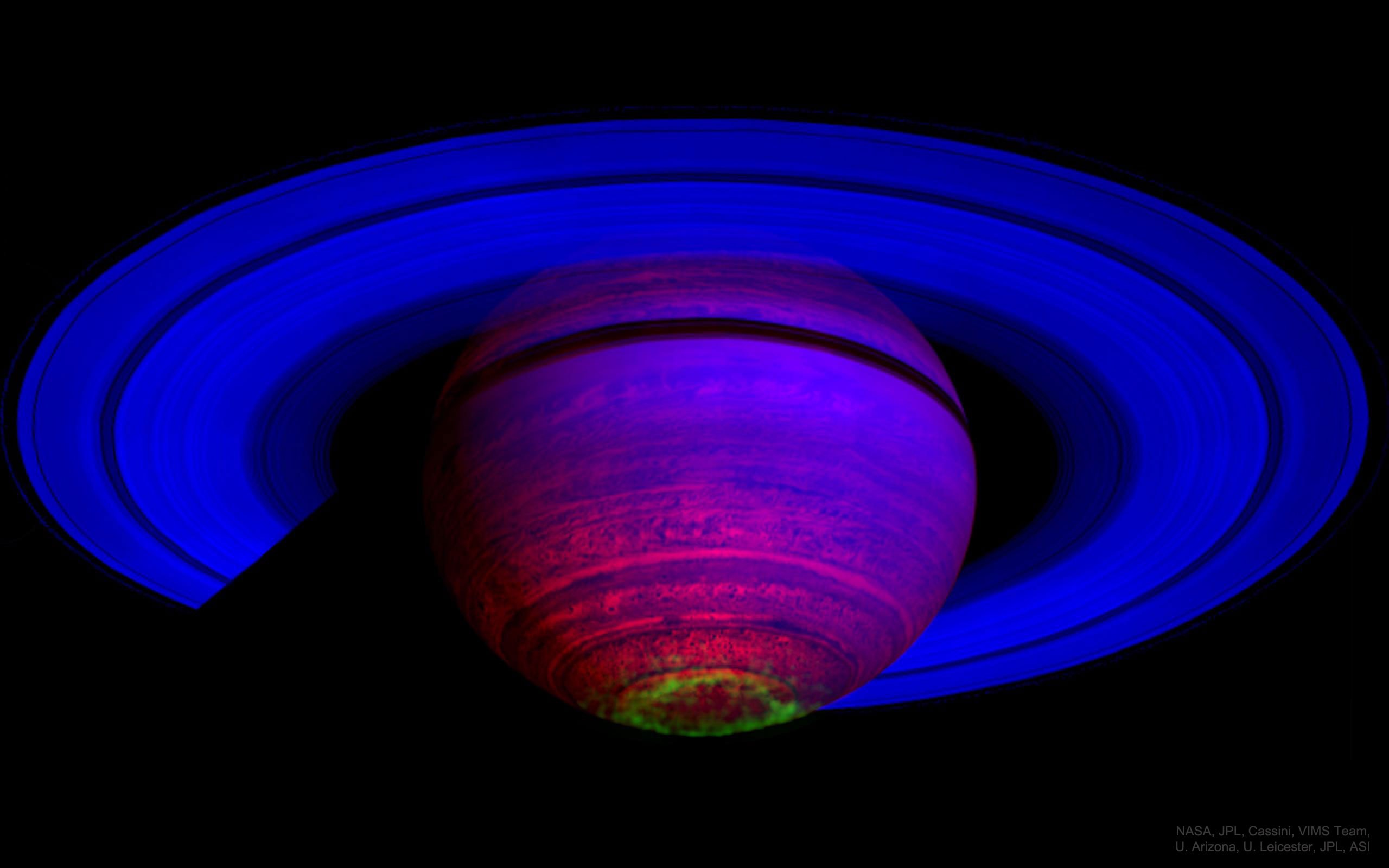 What drives auroras on Saturn? To help find out, scientists have sorted through hundreds of infrared images of Saturn taken by the Cassini spacecraft for other purposes, trying to find enough aurora images to correlate changes and make movies. Once made, some movies clearly show that Saturnian auroras can change not only with the angle of the Sun, but also as the planet rotates. Furthermore, some auroral changes appear related to waves in Saturn's magnetosphere likely caused by Saturn's moons. Pictured here, a false-colored image taken in 2007 shows Saturn in three bands of infrared light.  The rings reflect relatively blue sunlight, while the planet itself glows in comparatively low energy red.  A band of southern aurora in visible in green. In has recently been found that auroras heat Saturn's upper atmosphere. Understanding Saturn's auroras is a path toward a better understanding of Earth's auroras.