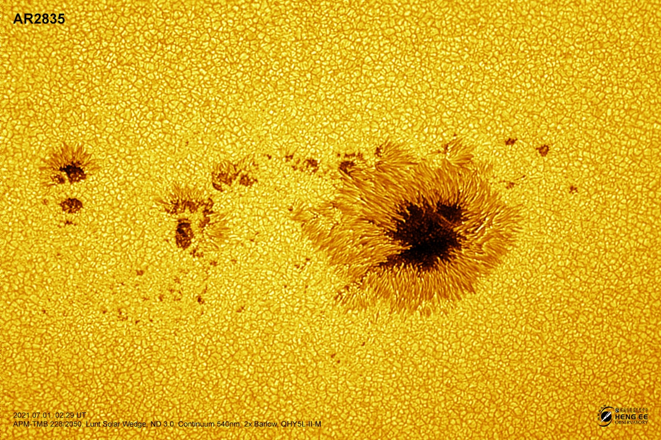 Awash in a sea of incandescent plasma and anchored in strong magnetic fields, sunspots are planet-sized dark islands in the solar photosphere, the bright surface of the Sun. Found in solar active regions, sunspots look dark only because they are slightly cooler though, with temperatures of about 4,000 kelvins compared to 6,000 kelvins for the surrounding solar surface. These sunspots lie in active region AR2835. The largest active region now crossing the Sun, AR2835 is captured in this sharp telescopic close-up from July 1 in a field of view that spans about 150,000 kilometers or over ten Earth diameters. With powerful magnetic fields, solar active regions are often responsible for solar flares and coronal mass ejections, storms which affect space weather near planet Earth.