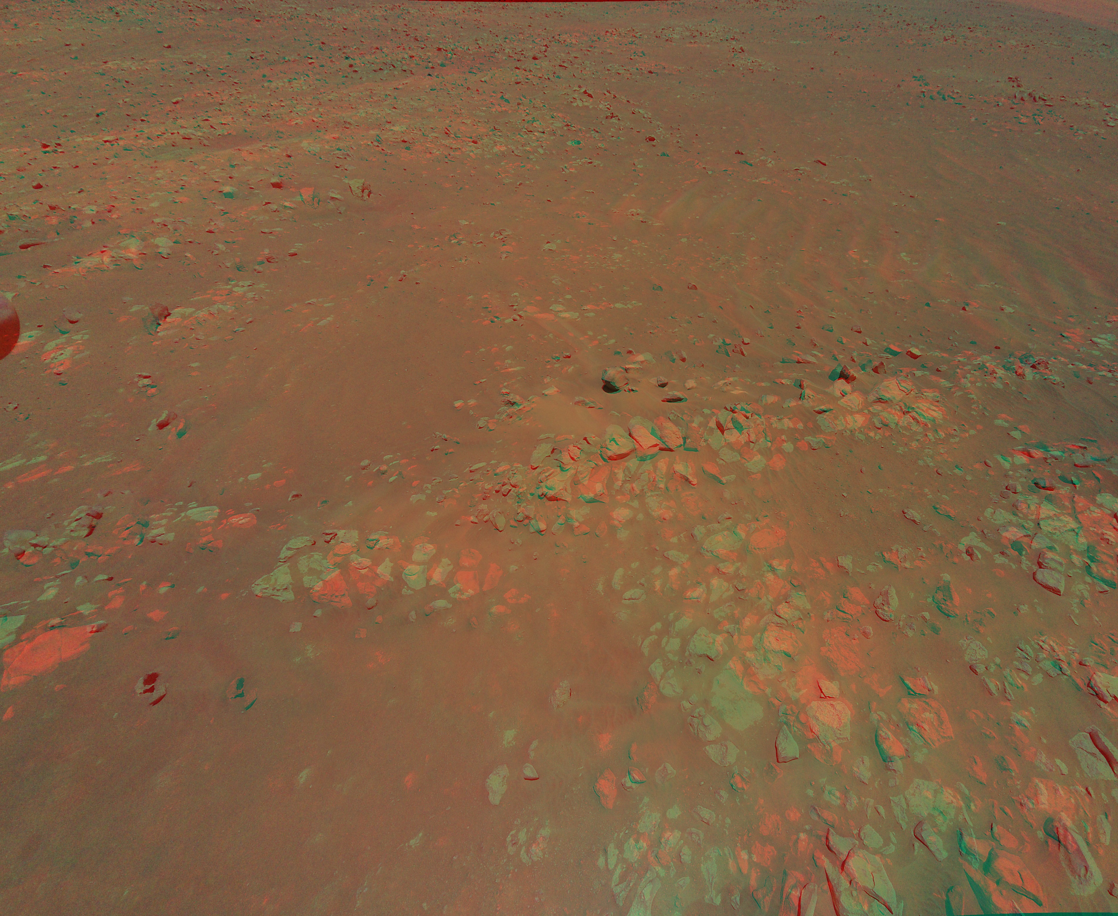Get out your red-blue glasses and hover over the surface of Mars. Taken on July 24, the 3D color view is from the Mars Ingenuity Helicopter's 10th flight above the Red Planet. Two images from Ingenuity's color camera, both captured at an altitude of 12 meters (40 feet), but a few meters apart to provide a stereo perspective, were used to construct the color anaglyph. Ingenuity's stereo images were made at the request of the Mars Perseverance rover science team. The team is considering a visit to these raised ridges on the floor of Jezero Crater during Perseverance's first science campaign.