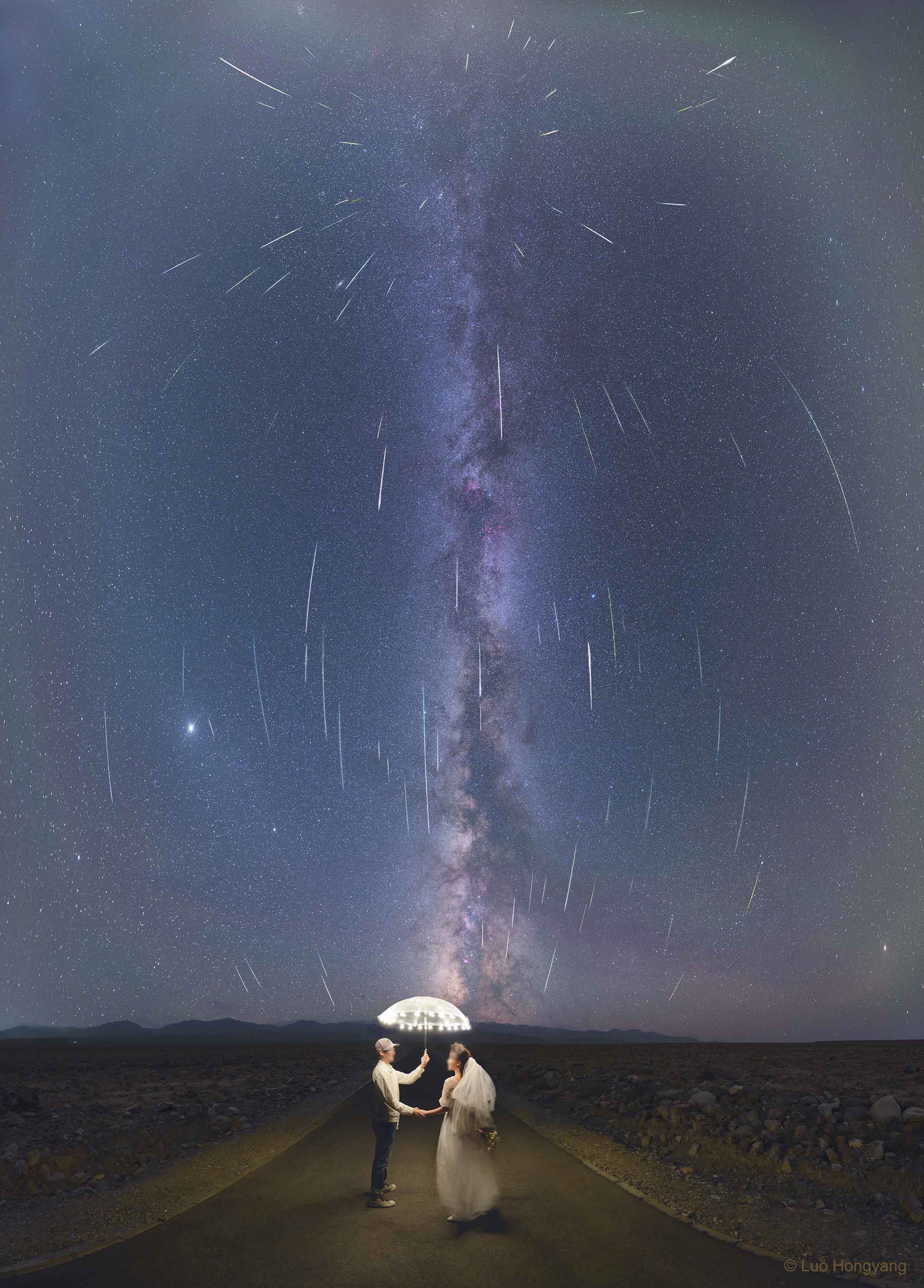 Comet dust rained down on planet Earth last week, streaking through dark skies in the annual Perseid meteor shower. The featured picture is a composite of many images taken from the same location over the peak night of the Perseids. The umbrella was not needed as a shield from meteors, since they almost entirely evaporate high in the Earth's atmosphere. Many of the component images featured individual Perseids, while one image featured the foreground near Jiuquan City, Gansu Province, China. The stellar background includes the central band of our Milky Way Galaxy, appearing nearly vertical, as well as the planets Jupiter and Saturn on the left. Although the comet dust particles are traveling parallel to each other, the resulting shower meteors clearly seem to radiate from a single point on the sky -- the radiant in the eponymous constellation Perseus. The image captured so long an angular field that the curvature of the sky is visible in the trajectory of the Perseids.   Notable APOD Image Submissions: Perseid Meteor Shower 2021