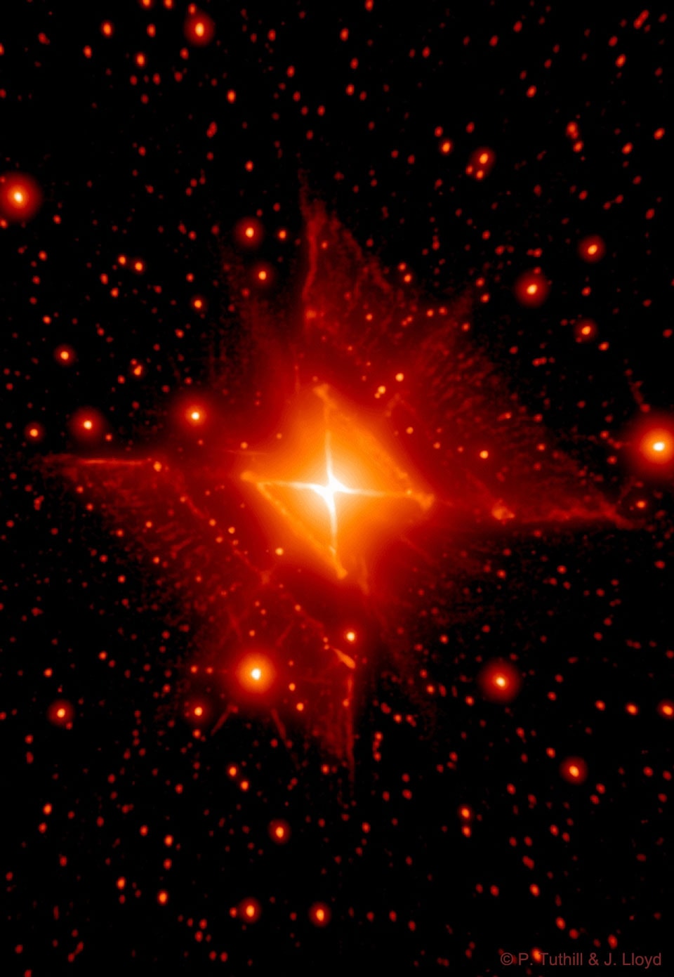 How did a round star create this square nebula? No one is quite sure. The round star, known as MWC 922 and possibly part of a multiple star system, appears at the center of the Red Square Nebula.  The featured image combines infrared exposures from the Hale Telescope on Mt. Palomar in California, and the Keck-2 Telescope on Mauna Kea in Hawaii.  A leading progenitor hypothesis for the square nebula is that the central star or stars somehow expelled cones of gas during a late developmental stage. For MWC 922, these cones happen to incorporate nearly right angles and be visible from the sides.  Supporting evidence for the cone hypothesis includes radial spokes in the image that might run along the cone walls. Researchers speculate that the cones viewed from another angle would appear similar to the gigantic rings of supernova 1987A, possibly indicating that a star in MWC 922 might one day itself explode in a similar supernova.