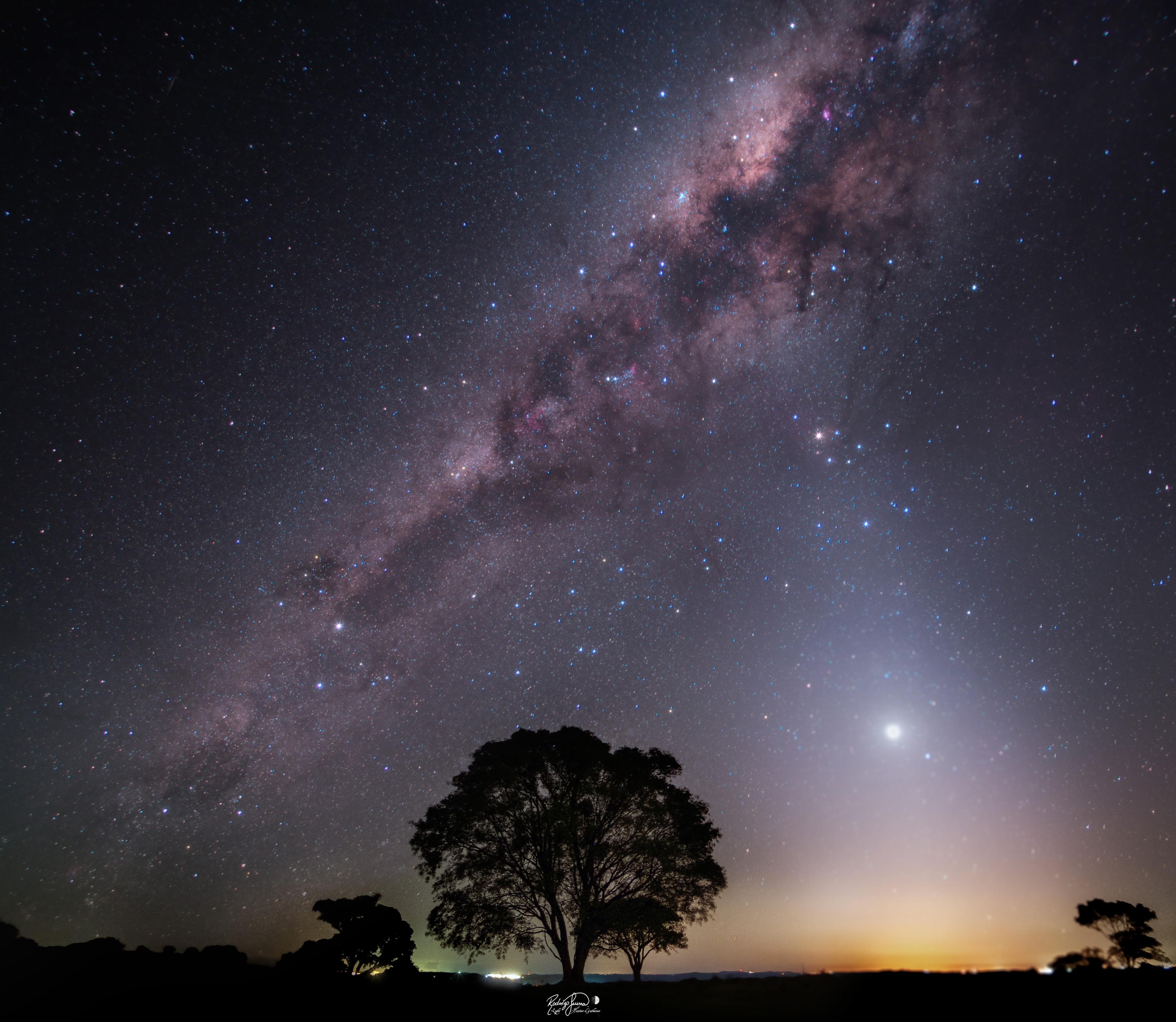 Posing as a brilliant evening star, Venus lies near the western horizon in this southern hemisphere, early spring, night skyscape. To create the composite view exposures tracking the sky and fixed for the foreground were taken on September 25 from Cascavel in southern Brazil. In view after sunset, Venus appears immersed in a cone of zodiacal light, sunlight scattered from dust along the Solar System's ecliptic plane. In fact from either hemisphere of planet Earth, zodiacal light is most visible after sunset near a spring equinox, (or before sunrise near an autumn equinox) when its luminous arc lies at steep angles to the horizon. Extending above the sunset on this night, the zodiacal light reaches toward rich starfields and immense interstellar dust clouds in the bulge of the central Milky Way. Follow along the Milky Way from the central bulge back toward the horizon and you'll spot the closest star system to the Sun, Alpha Centauri, a mere 4.37 light-years away.