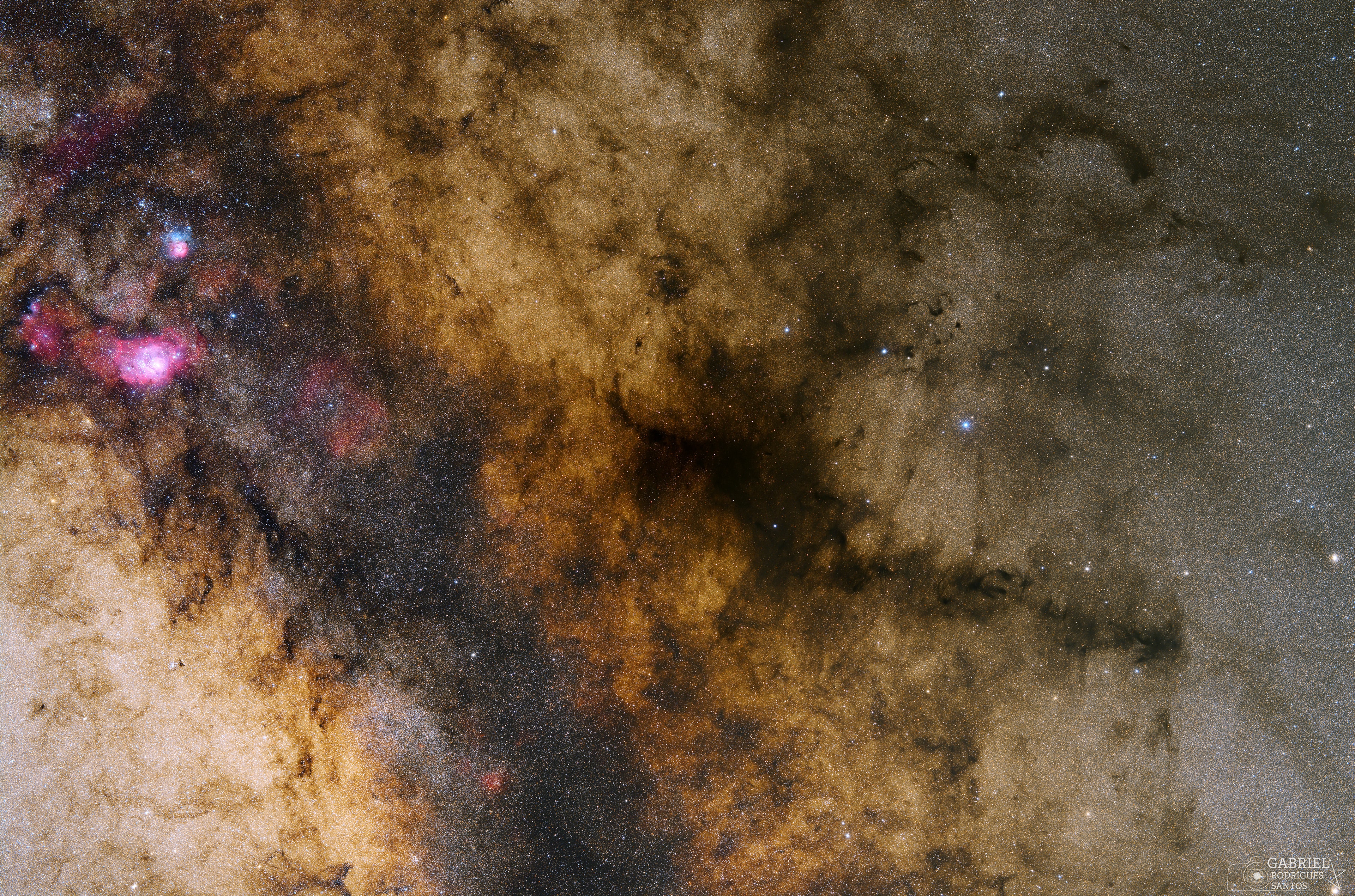 Dark markings and colorful clouds inhabit this stellar landscape. The deep and expansive view spans more than 30 full moons across crowded star fields toward the center of our Milky Way Galaxy. Cataloged in the early 20th century by astronomer E. E. Barnard, the obscuring interstellar dust clouds seen toward the right include B59, B72, B77 and B78, part of the Ophiuchus molecular cloud complex a mere 450 light-years away. To the eye their combined shape suggests a pipe stem and bowl, and so the dark nebula's popular name is the Pipe Nebula. Three bright nebulae gathered on the left are stellar nurseries some 5,000 light-years distant toward the constellation Sagittarius. In the 18th century astronomer Charles Messier included two of them in his catalog of bright clusters and nebulae; M8, the largest of the triplet, and colorful M20 just above. The third prominent emission region includes NGC 6559 at the far left. Itself divided by obscuring dust lanes, M20 is also known as the Trifid. M8's popular moniker is the Lagoon Nebula.