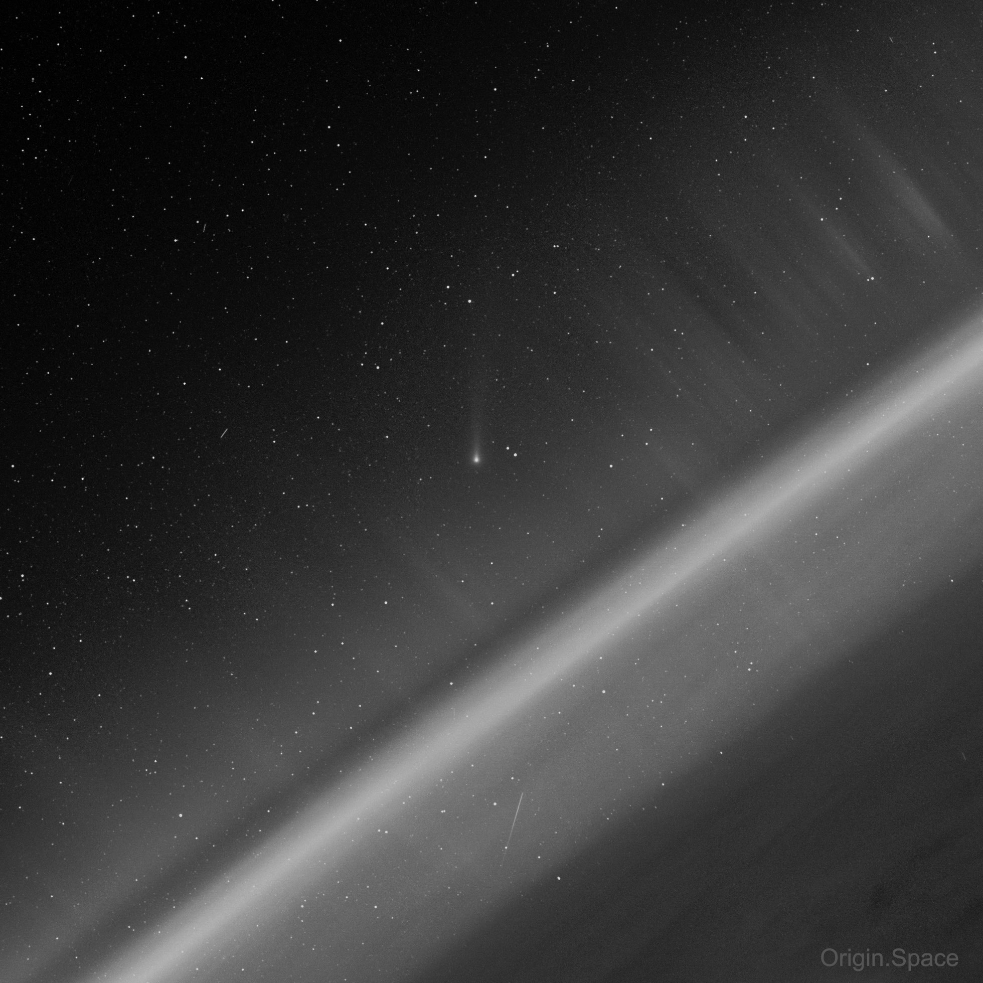 What does Comet Leonard look like from space?  Today's featured image from Origin.Space's Yangwang-1 space telescope shows not only the currently bright comet -- but several other space delights as well. Taken in optical and ultraviolet light, C/2021 A1 (Leonard) is visible with an extended tail near the image center as it appeared five days ago.  The Earth is visible on the lower right, while layers of the Earth's atmosphere glow diagonally from the lower left to the upper right. The trails of two satellites can be seen in front of a myriad of distant stars that dot the background on the upper left. The faint bands of light running diagonally from the lower right to the upper left are auroras. Finally, the image also caught a meteor streaking just below the airglow. To see Comet Leonard yourself from the Earth's surface during the next few days, look toward the western horizon just after sunset or just before sunrise.