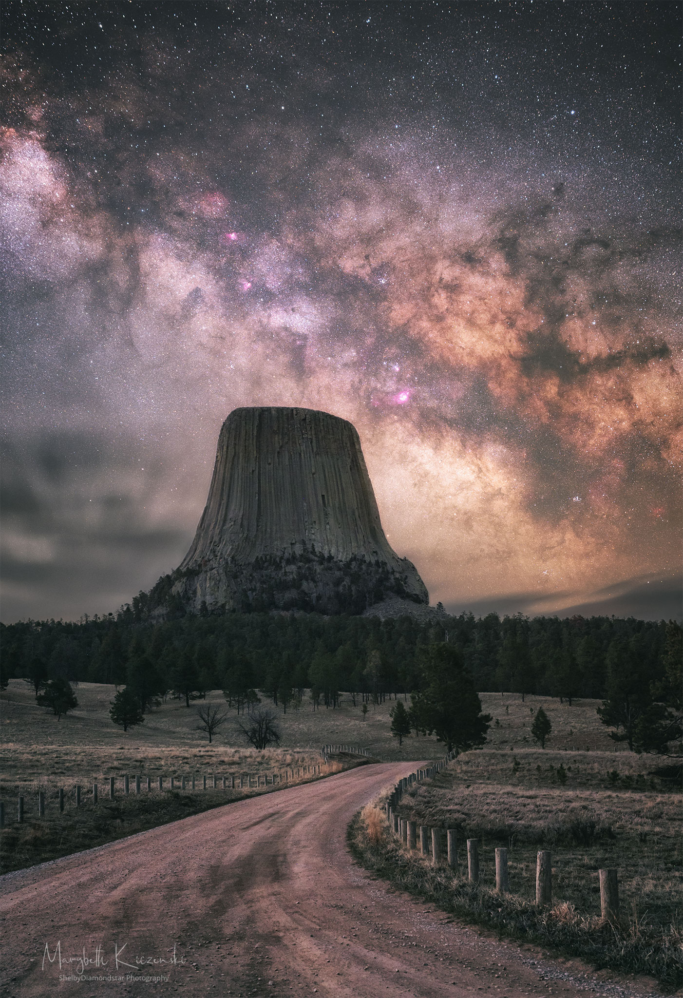 What created Devils Tower? The origin of this extraordinary rock monolith in Wyoming, USA is still debated, with a leading hypothesis holding that it is a hardened lava plume that never reached the surface to become a volcano.  In this theory, the lighter rock that once surrounded the dense volcanic neck has now eroded away, leaving the dramatic tower. Known by Native Americans by names including  Bear's Lodge and Great Gray Horn, the dense rock includes the longest hexagonal columns known, some over 180-meters tall. High above, the central band of the Milky Way galaxy arches across the sky.  Many notable sky objects are visible, including dark strands of the Pipe Nebula and the reddish Lagoon Nebula to the tower's right.  Green grass and trees line the foreground, while clouds appear near the horizon to the tower's left.  Unlike many other international landmarks, mountaineers are permitted to climb Devils Tower.   Birthday Surprise: What picture did APOD feature on your birthday? (post 1995)