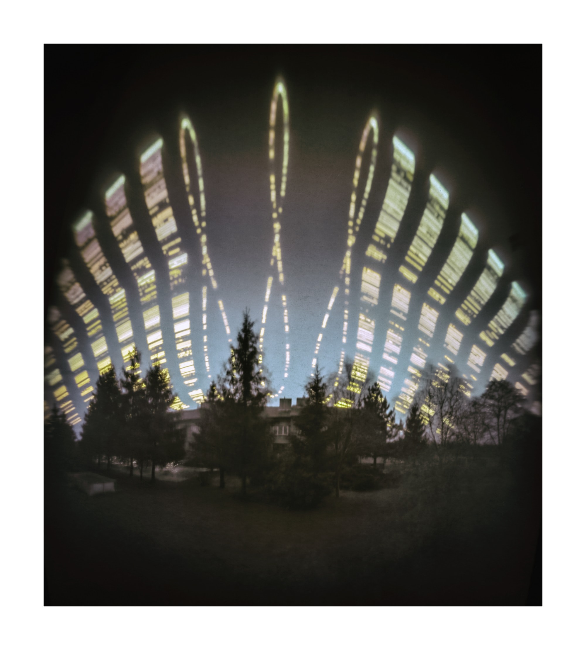 For the northern hemisphere June 21 was the summer solstice, the Sun reaching its northernmost declination for the year. That would put it at the top of each of these three figure-8 curves, or analemmas, as it passed through the daytime sky over the village of Proboszczow, Poland. No sequence of digital exposures was used to construct the remarkable image though. Using a pinhole camera fixed to face south during the period June 26, 2021 to June 26, 2022, the image was formed directly on a single sheet of photographic paper, a technique known as solargraphy. The three analemmas are the result of briefly exposing the photo paper through the pinhole each day at 11:00, 12:00, and 13:00 CET. Groups of dashed lines on the sides show partial tracks of the Sun from daily exposures made every 15 minutes. Over the year-long solargraphic photo opportunity clouds blocking the Sun during the pinhole exposures created the dark gaps.