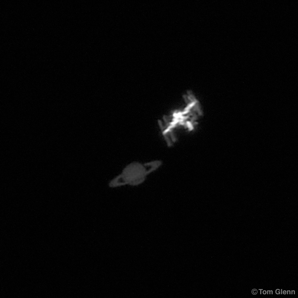 Soaring high in skies around planet Earth, bright planet Saturn was a star of June's morning planet parade. But very briefly on June 24 it posed with a bright object in low Earth orbit, the International Space Station. On that date from a school parking lot in Temecula, California the ringed-planet and International Space Station were both caught in this single high-speed video frame. Though Saturn was shining at +0.5 stellar magnitude the space station was an even brighter -3 on the magnitude scale. That difference in brightness is faithfully represented in the video capture frame. In the challenging image, the orbiting ISS was at a range of 602 kilometers. Saturn was about 1.4 billion kilometers from the school parking lot.