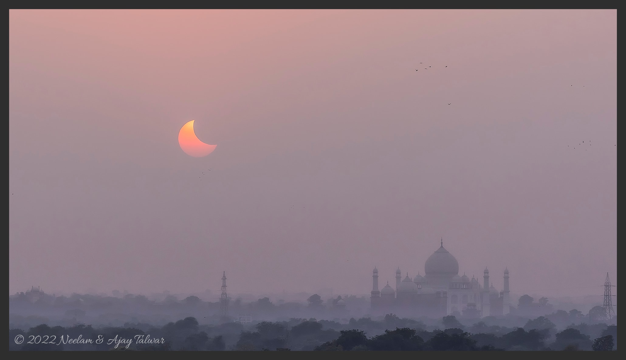 On October 25th, Sun and New Moon set together as seen from Agra, India. Their close conjunction near the western horizon, a partial solar eclipse, was captured in this elevated view in hazy skies near the solitary dome of the Taj Mahal. Of course, the partial solar eclipse was also seen from most of Europe, northern Africa, the Middle East, and western parts of Asia. This eclipse was the last of two solar eclipses (both partial eclipses) in 2022. But the next Full Moon will slide through planet Earth's shadow on November 7/8, in a total lunar eclipse.