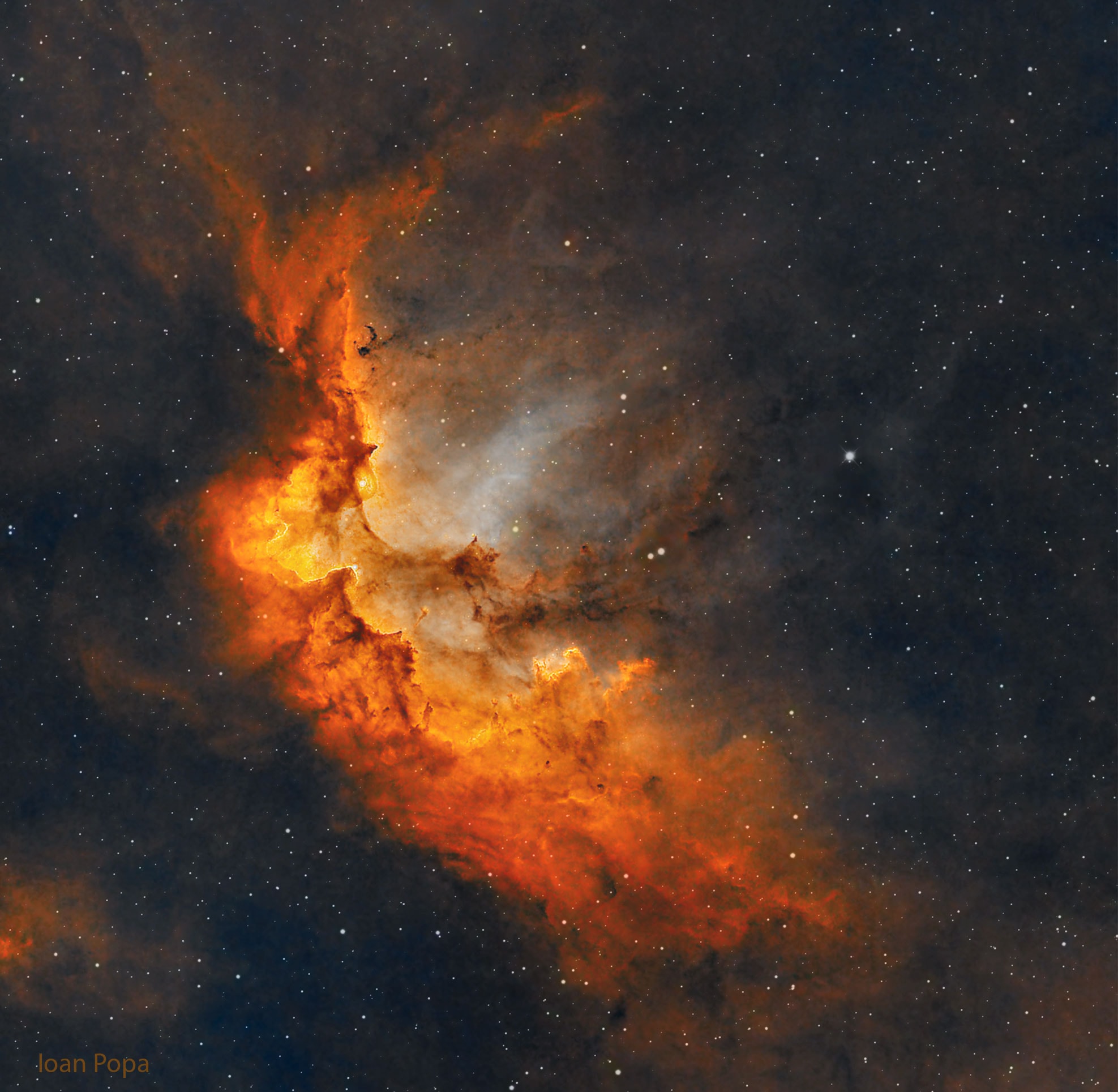 What powers are being wielded in the Wizard Nebula?  Gravitation strong enough to form stars, and stellar winds and radiations powerful enough to create and dissolve towers of gas.  Located only 8,000 light years away, the Wizard nebula, featured here, surrounds developing open star cluster NGC 7380.  Visually, the interplay of stars, gas, and dust has created a shape that appears to some like a fictional medieval sorcerer.  The active star forming region spans 100 about light years, making it appear larger than the angular extent of the Moon.  The Wizard Nebula can be located with a small telescope toward the constellation of the King of Aethiopia (Cepheus).  Although the nebula may last only a few million years, some of the stars being formed may outlive our Sun.