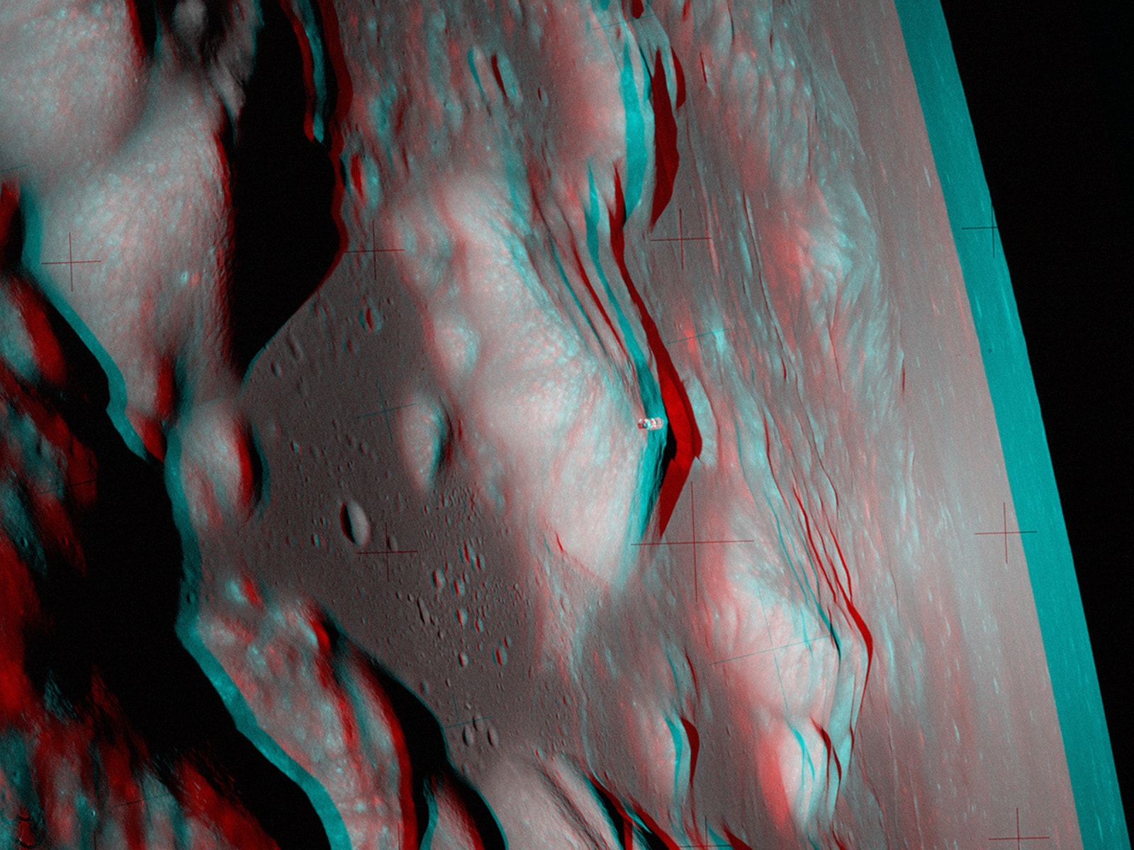 Get out your red/blue glasses and check out this stereo view of another world. Fifty years ago the scene was recorded by Apollo 17 mission commander Eugene Cernan on December 11, 1972, one orbit before descending to land on the Moon. The stereo anaglyph was assembled from two photographs (AS17-147-22465, AS17-147-22466) captured from his vantage point on board the Lunar Module Challenger as he and Dr. Harrison Schmitt flew over Apollo 17's landing site in the Taurus-Littrow Valley. The broad, sunlit face of the mountain dubbed South Massif rises near the center of the frame, above the dark floor of Taurus-Littrow to its left. Piloted by Ron Evans, the Command Module America is visible in orbit in the foreground against the South Massif's peak. Beyond the mountains, toward the lunar limb, lies the Moon's Mare Serenitatis.