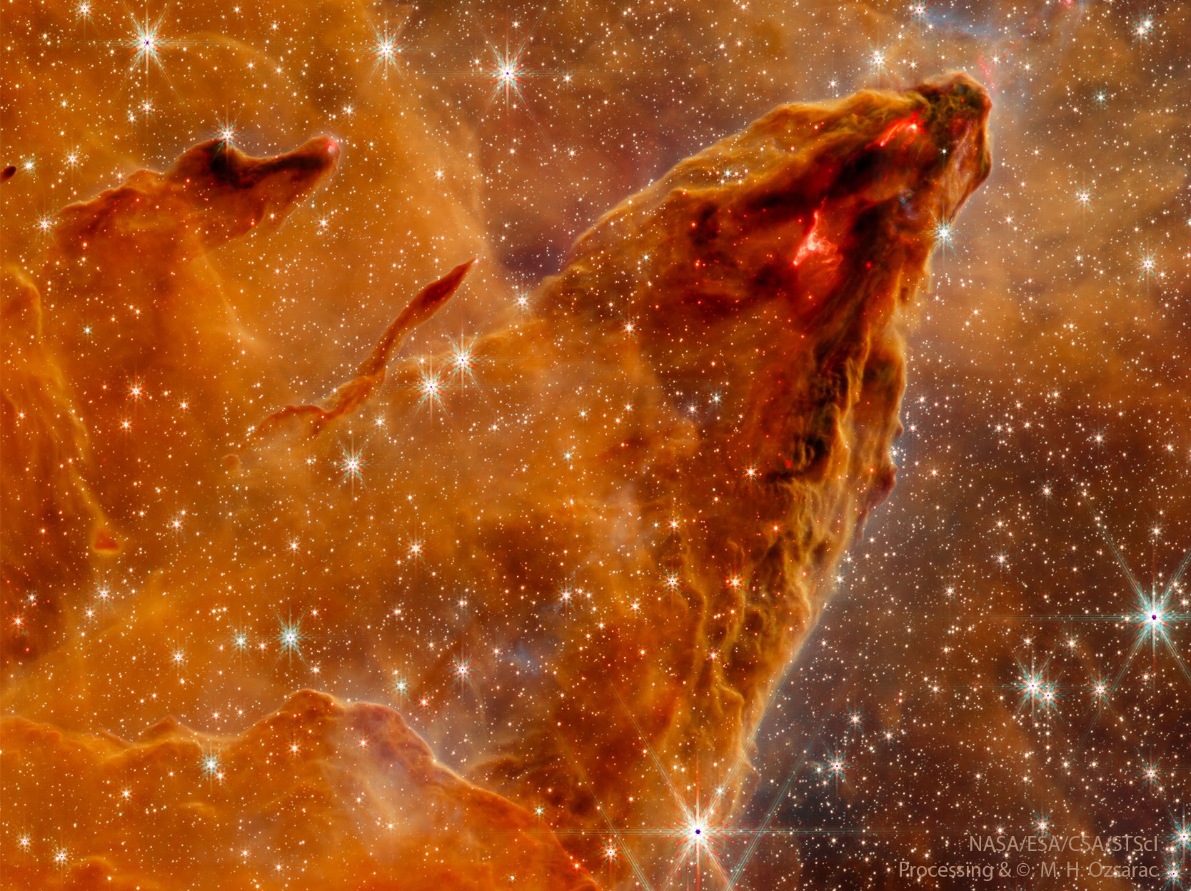 What’s happening inside this interstellar mountain? Stars are forming. The mountain is actually a column of gas and dust in the picturesque Eagle Nebula (M16).  A pillar like this is so low in density that you could easily fly though it -- it only appears solid because of its high dust content and great depth. The glowing areas are lit internally by newly formed stars. These areas shine in red and infrared light because blue light is scattered away by intervening interstellar dust. The featured image was captured recently in near-infrared light in unprecedented detail by the James Webb Space Telescope (JWST), launched late last year. Energetic light, abrasive winds, and final supernovas from these young stars will slowly destroy this stellar birth column over the next 100,000 years.   Astrophysicists: Browse 2,900+ codes in the Astrophysics Source Code Library