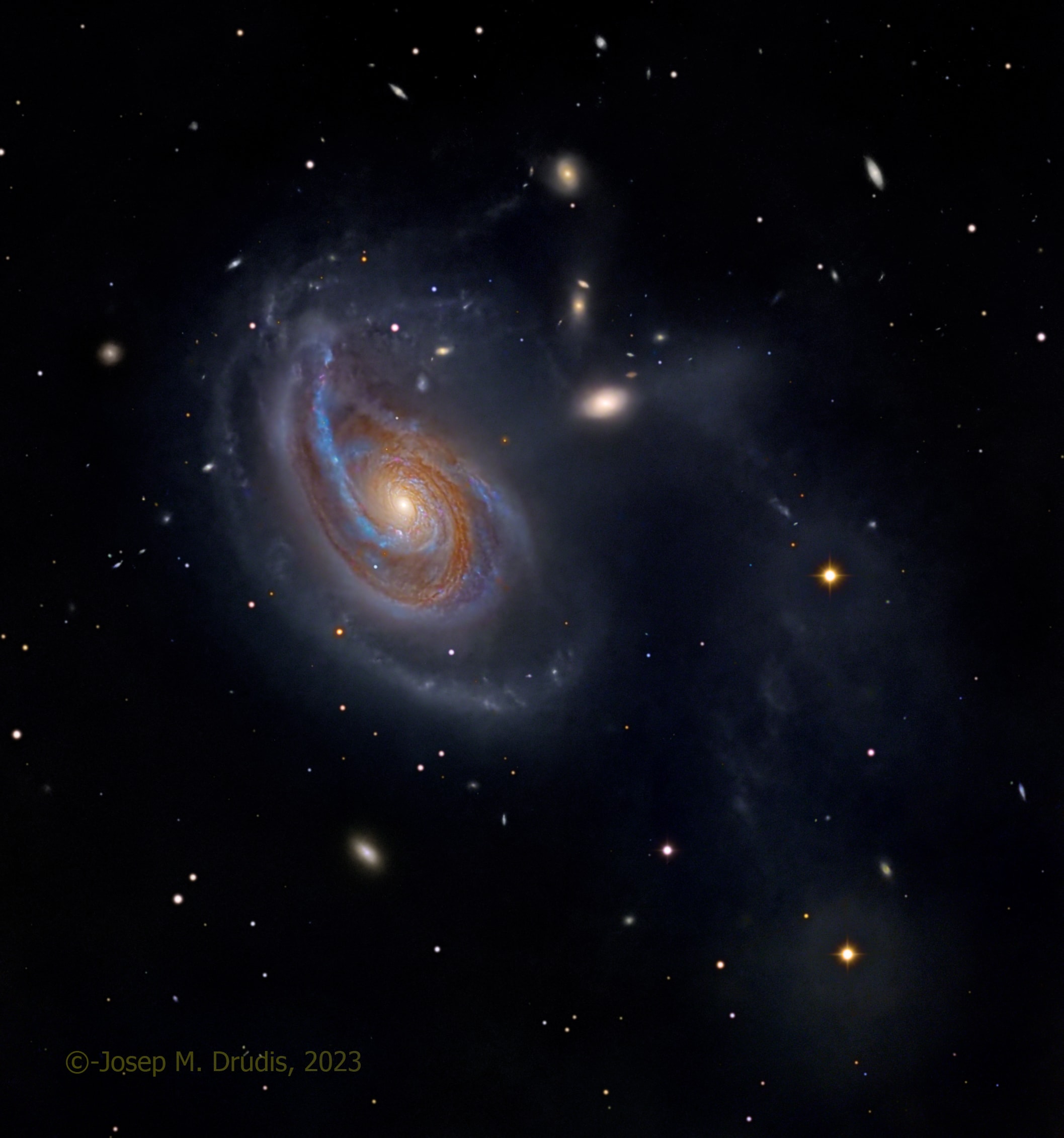 Peculiar spiral galaxy Arp 78 is found within the boundaries of the head strong constellation Aries. Some 100 million light-years beyond the stars and nebulae of our Milky Way galaxy, the island universe is an enormous 200,000 light-years across. Also known as NGC 772, it sports a prominent, outer spiral arm in this detailed cosmic portrait. Tracking along sweeping dust lanes and lined with young blue star clusters, Arp 78's overdeveloped spiral arm is pumped-up by galactic-scale gravitational tides. Interactions with its brightest companion galaxy, the more compact NGC 770 seen above and right of the larger spiral, are likely responsible. Embedded in faint star streams revealed in the deep telescopic exposure, NGC 770's fuzzy, elliptical appearance contrasts nicely with spiky foreground Milky Way stars in matching yellowish hues.