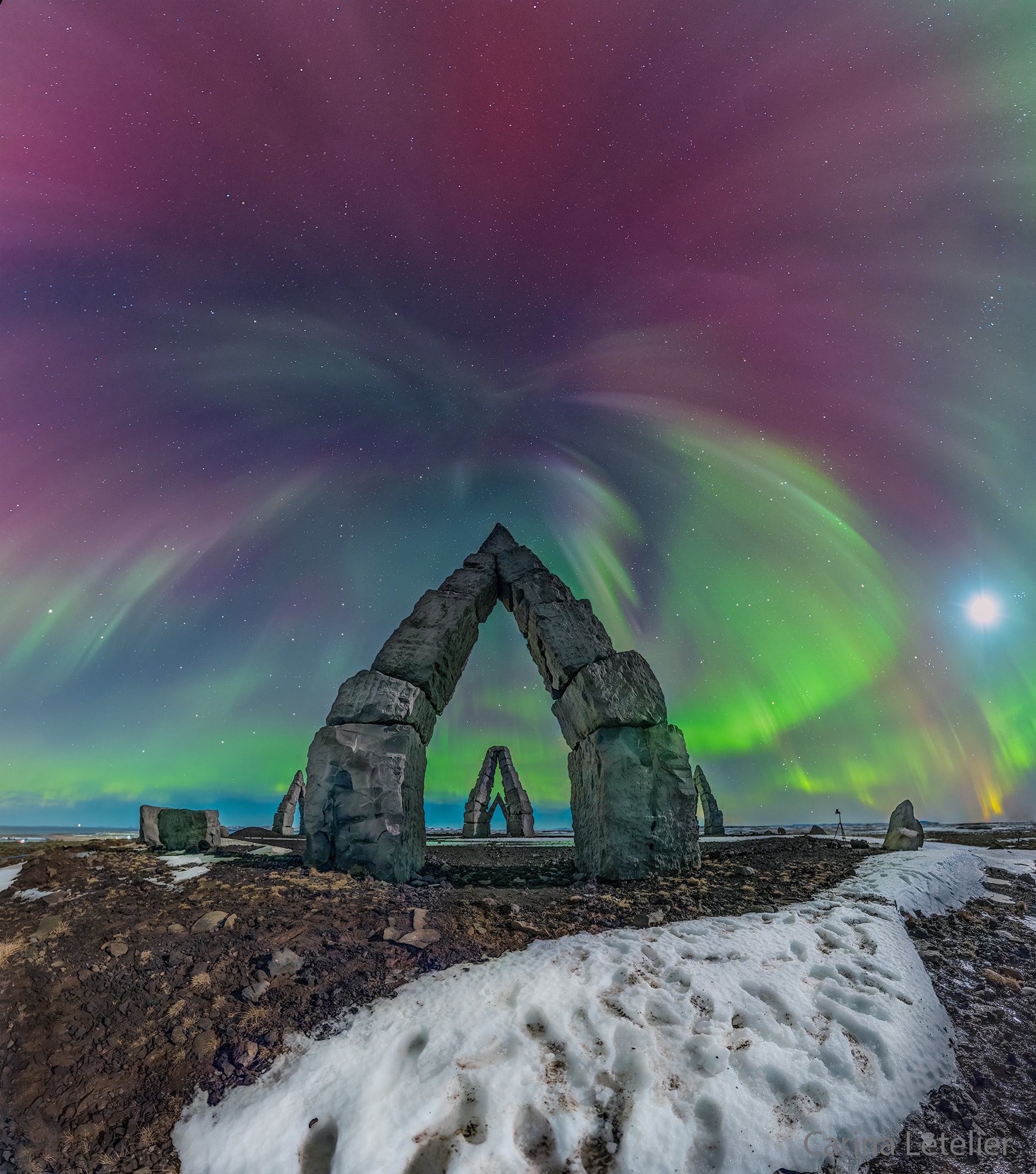 Reports of powerful solar flares started a seven-hour quest north to capture modern monuments against an aurora-filled sky.  The peaks of iconic Arctic Henge in Raufarhöfn in northern Iceland were already aligned with the stars: some are lined up toward the exact north from one side and toward exact south from the other. The featured image, taken after sunset late last month, looks directly south, but since the composite image covers so much of the sky, the north star Polaris is actually visible at the very top of the frame. Also visible are familiar constellations including the Great Bear (Ursa Major) on the left, and the Hunter (Orion) on the lower right. The quest was successful.  The sky lit up dramatically with bright and memorable auroras that shimmered with amazing colors including red, pink, yellow, and green -- sometimes several at once.