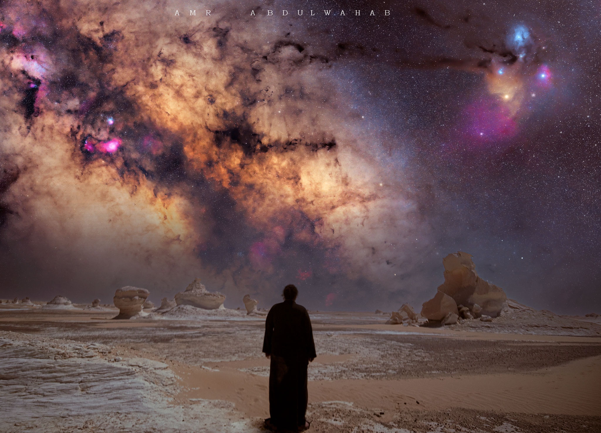 For ten years the stargazer dreamed of taking a picture like this. The dreamer knew that the White Desert National Park in Egypt's Western Desert is a picturesque place hosting numerous chalk formations sculpted into surreal structures by a sandy wind. The dreamer knew that the sky above could be impressively dark on a clear moonless night, showing highlights such as the central band of our Milky Way Galaxy in impressive color and detail. So the dreamer invited an even more experienced astrophotographer to spend three weeks together in the desert and plan the composite images that needed to be taken and processed to create the dream image.  Over three days in mid-March, the base images were taken, all with the same camera and from the same location.  The impressive result is featured here, with the dreamer -- proudly wearing a traditional Bedouin galabyia -- pictured in the foreground.