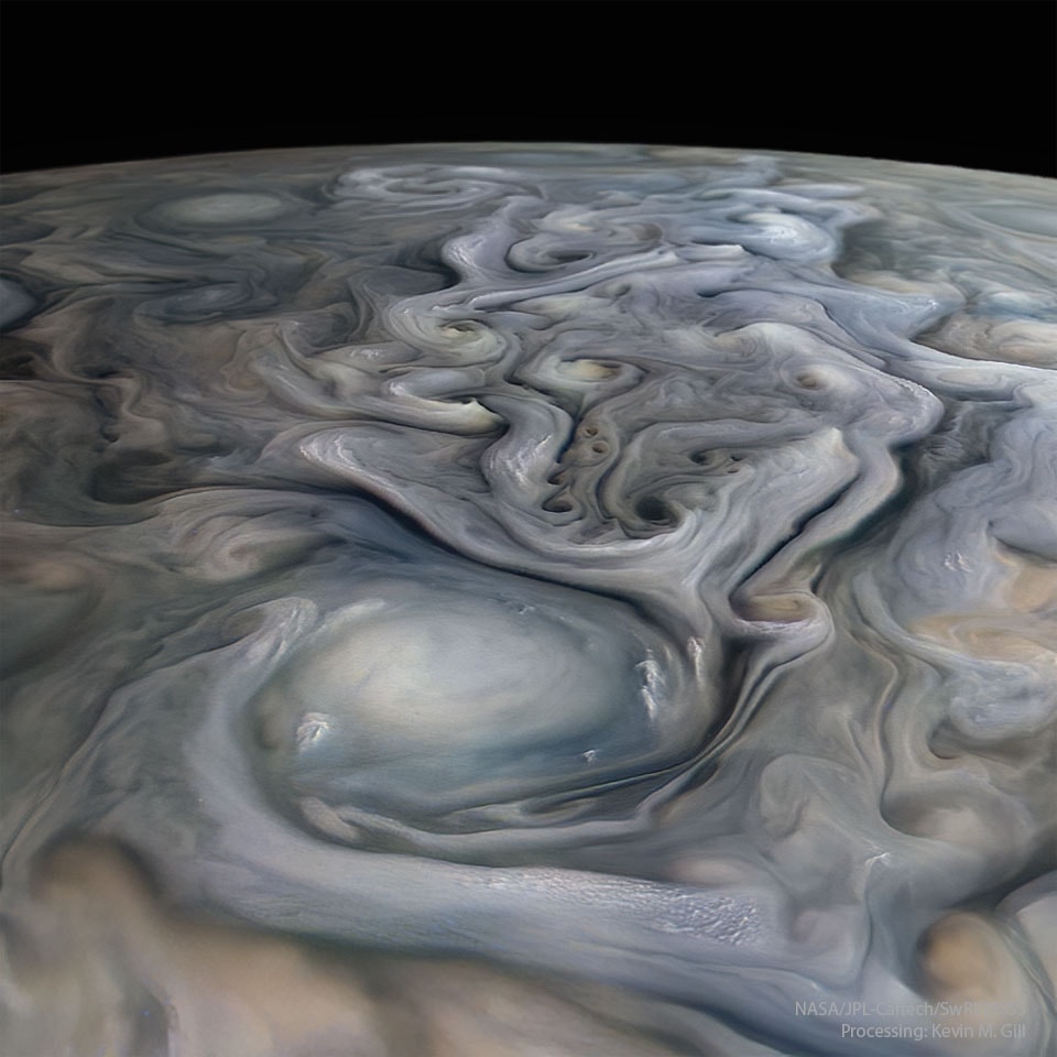 Big storms are different on Jupiter. On Earth, huge hurricanes and colossal cyclones are centered on regions of low pressure, but on Jupiter, it is the high-pressure, anti-cyclone storms that are the largest. On Earth, large storms can last weeks, but on Jupiter they can last years. On Earth, large storms can be as large as a country, but on Jupiter, large storms can be as large as planet Earth. Both types of storms are known to exhibit lightning. The featured image of Jupiter's clouds was composed from images and data captured by the robotic Juno spacecraft as it swooped close to the massive planet in August 2020.  A swirling white oval is visible nearby, while numerous smaller cloud swirls extend into the distance.  On Jupiter, light-colored clouds are usually higher up than dark clouds. Despite their differences, studying storm clouds on distant Jupiter provides insights into storms and other weather patterns on familiar Earth.     Surf the Universe: Random APOD Generator