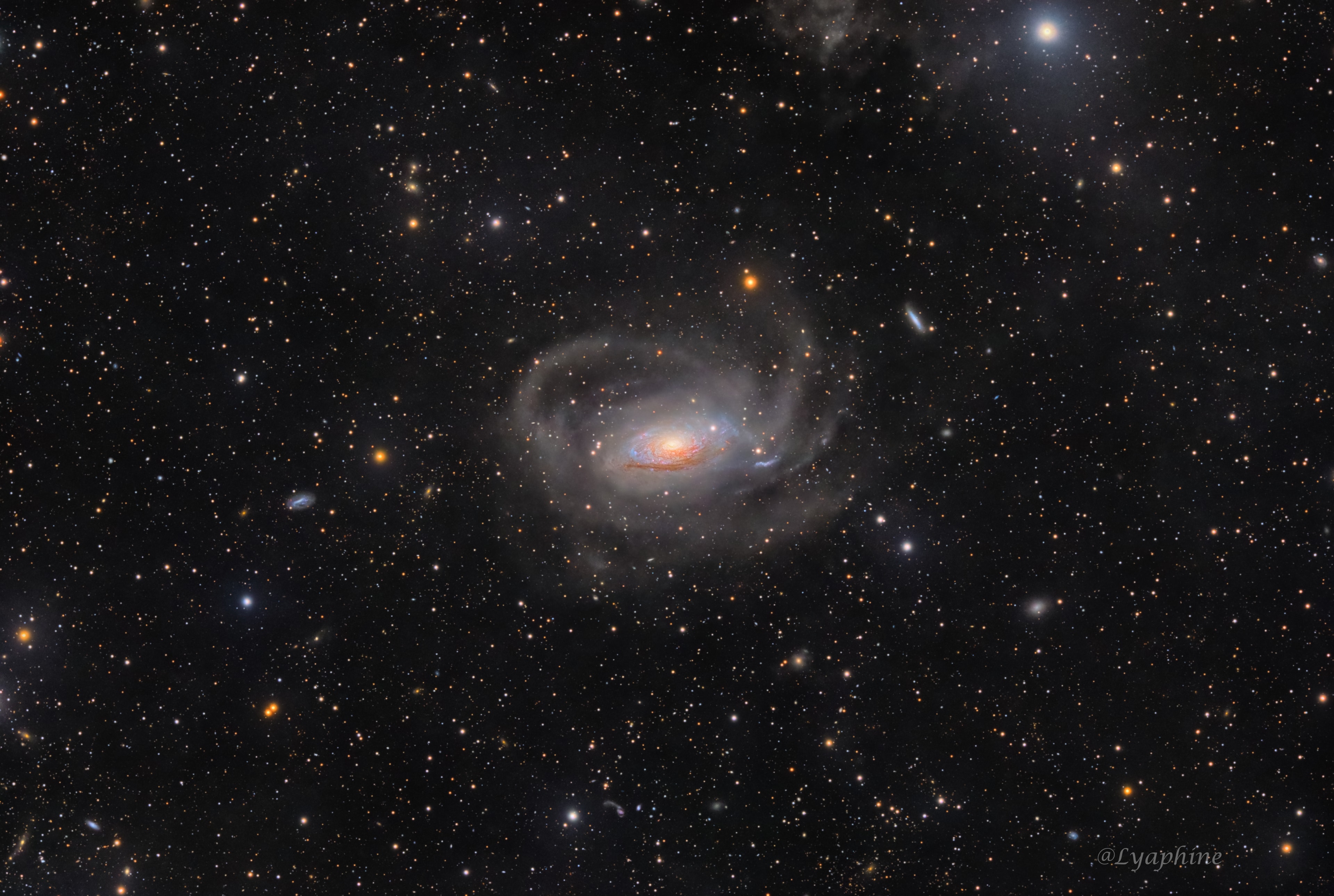 A bright spiral galaxy of the northern sky, Messier 63 is nearby, about 30 million light-years distant toward the loyal constellation Canes Venatici. Also cataloged as NGC 5055, the majestic island universe is nearly 100,000 light-years across, about the size of our own Milky Way. Its bright core and majestic spiral arms lend the galaxy its popular name, The Sunflower Galaxy. This exceptionally deep exposure also follows faint, arcing star streams far into the galaxy's halo. Extending nearly 180,000 light-years from the galactic center, the star streams are likely remnants of tidally disrupted satellites of M63. Other satellite galaxies of M63 can be spotted in the remarkable wide-field image, including faint dwarf galaxies, which could contribute to M63's star streams in the next few billion years.