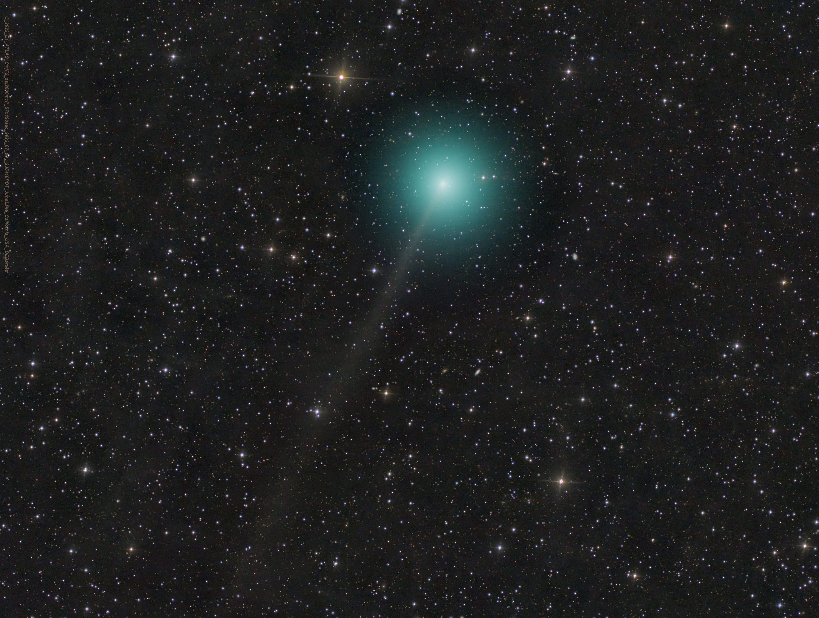 Comet C/2023 E1 (ATLAS) was just spotted in March, another comet found by the NASA funded Asteroid Terrestrial-impact Last Alert System.  On July 1 this Comet ATLAS reached perihelion, its closest approach to the Sun. Days later the telescopic comet was captured in this frame sporting a pretty greenish coma and faint, narrow ion tail against a background of stars in the far northern constellation Ursa Minor.  This comet's closest approach to Earth is still to come though. On August 18 this visitor to the inner Solar System will be a mere 3 light-minutes or so from our fair planet. Based on its inclination to the ecliptic plane and orbital period of about 85 years C/2023 E1 (ATLAS) is considered a Halley-type comet.