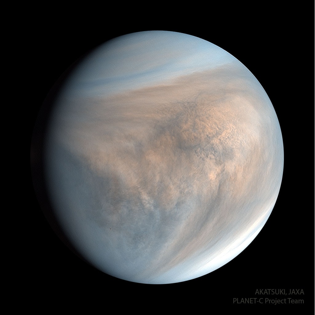 Why is Venus so different from Earth?  To help find out, Japan launched the robotic Akatsuki spacecraft which entered orbit around Venus late in 2015 after an unplanned five-year adventure around the inner Solar System.  Even though Akatsuki was past its original planned lifetime, the spacecraft and instruments were operating so well that much of its original mission was reinstated. Also known as the Venus Climate Orbiter, Akatsuki's instruments investigated unknowns about Earth's sister planet, including whether volcanoes are still active, whether lightning occurs in the dense atmosphere, and why wind speeds greatly exceed the planet's rotation speed. In the featured image taken by Akatsuki's UVI camera, the day-side of Venus is seen shown with planet-scale V-shaped cloud pattern. The image displays three ultraviolet colors and indicates a dip in the relative abundance of sulfur dioxide shown in faint blue.  Analyses of Akatsuki images and data has shown, among other discoveries, that Venus has equatorial jet similar to Earth's jet stream.