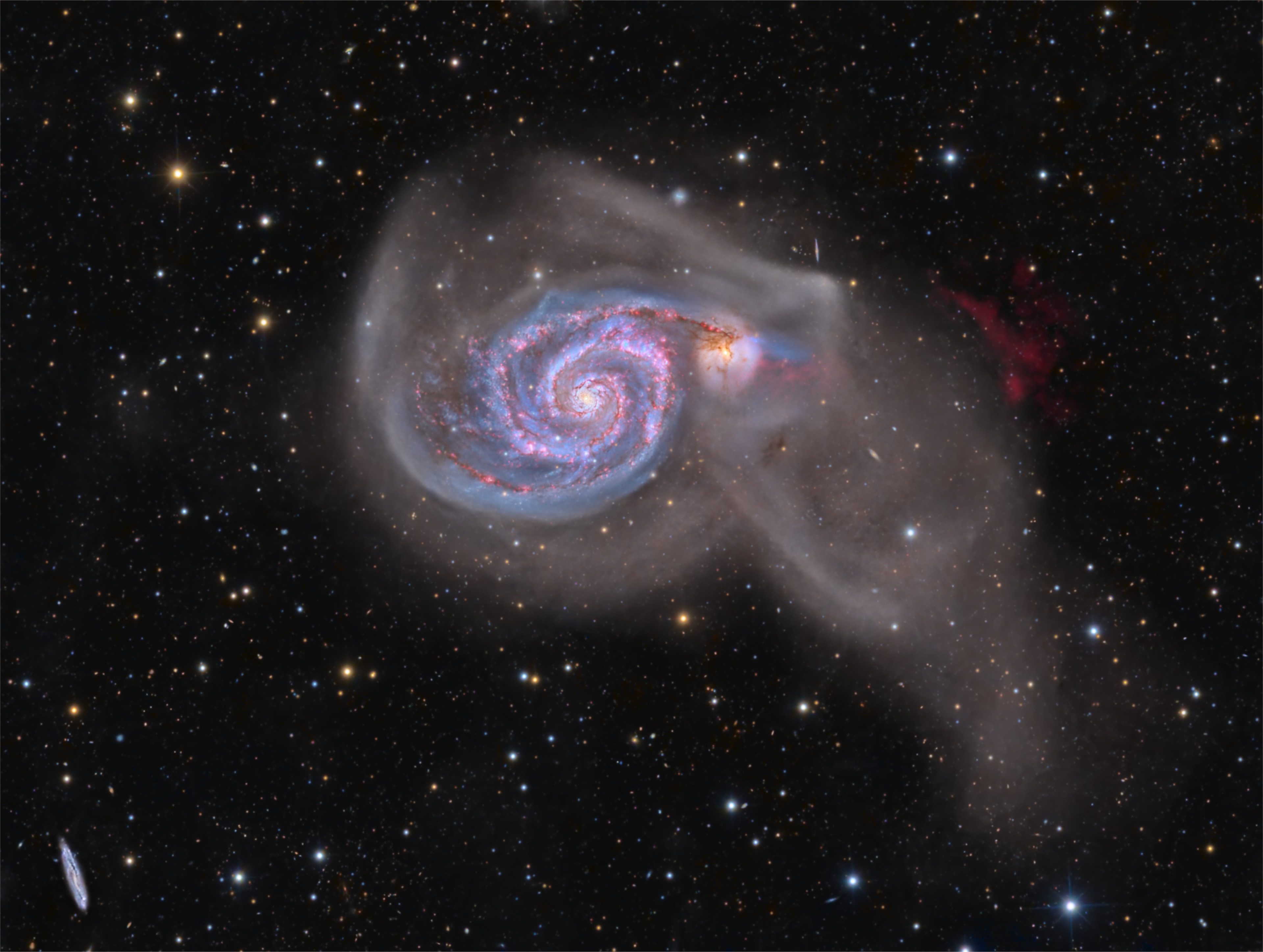 An intriguing pair of interacting galaxies, M51 is the 51st entry in Charles Messier's famous catalog. Perhaps the original spiral nebula, the large galaxy with whirlpool-like spiral structure seen nearly face-on is also cataloged as NGC 5194. Its spiral arms and dust lanes sweep in front of a companion galaxy (right), NGC 5195. Some 31 million light-years distant, within the boundaries of the well-trained constellation Canes Venatici, M51 looks faint and fuzzy to the eye in direct telescopic views. But this remarkably deep image shows off stunning details of the galaxy pair's striking colors and extensive tidal debris. A collaboration of astro-imagers using telescopes on planet Earth combined over 10 days of exposure time to create this definitive galaxy portrait of M51. The image includes 118 hours of narrowband data that also reveals a vast glowing cloud of reddish ionized hydrogen gas discovered in the M51 system.  Weekend Watch: Perseid Meteor Shower