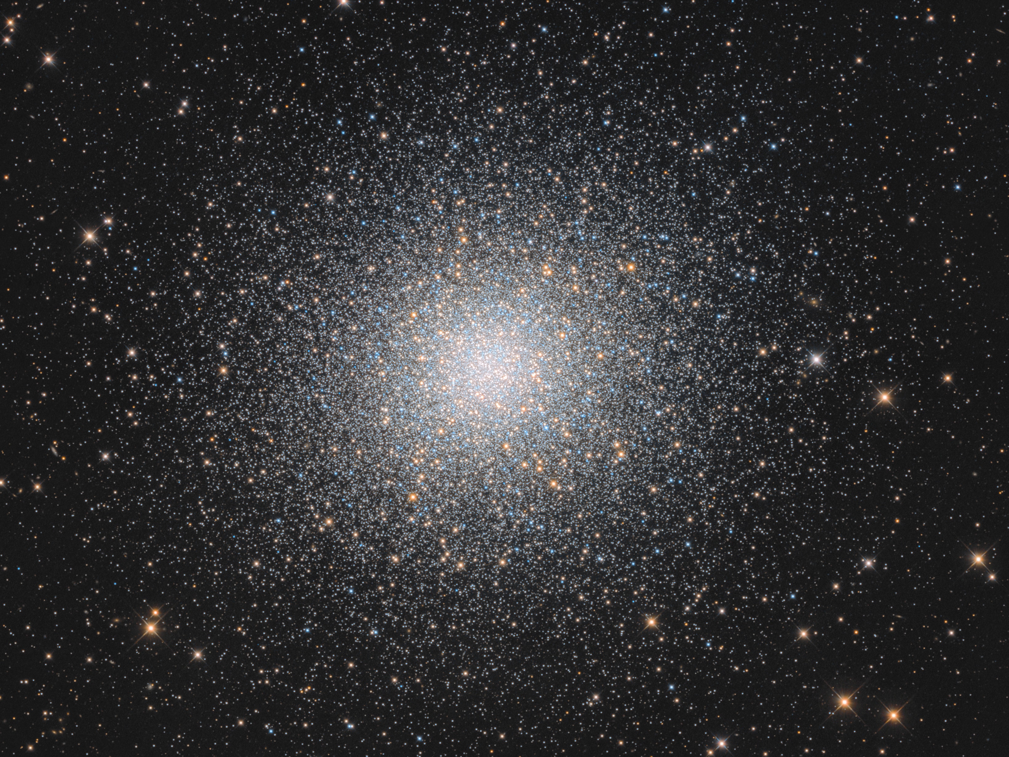 In 1716, English astronomer Edmond Halley noted, "This is but a little Patch, but it shows itself to the naked Eye, when the Sky is serene and the Moon absent." Of course, M13 is now less modestly recognized as the Great Globular Cluster in Hercules, one of the brightest globular star clusters in the northern sky. Sharp telescopic views like this one reveal the spectacular cluster's hundreds of thousands of stars. At a distance of 25,000 light-years, the cluster stars crowd into a region 150 light-years in diameter. Approaching the cluster core, upwards of 100 stars could be contained in a cube just 3 light-years on a side. For comparison, the closest star to the Sun is over 4 light-years away. The remarkable range of brightness recorded in this image follows stars into the dense cluster core.