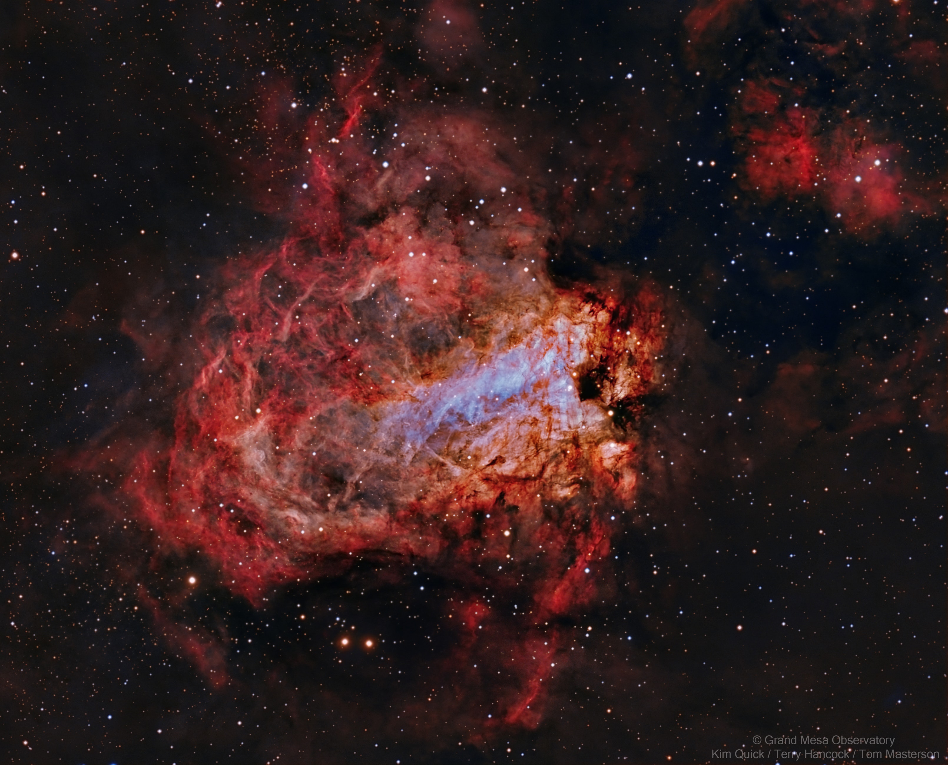 Sculpted by stellar winds and radiation, the star factory known as Messier 17 lies some 5,500 light-years away in the nebula-rich constellation Sagittarius. At that distance, this 1/3 degree wide field of view spans over 30 light-years. The sharp composite, color image highlights faint details of the region's gas and dust clouds against a backdrop of central Milky Way stars. Stellar winds and energetic light from hot, massive stars formed from M17's stock of cosmic gas and dust have slowly carved away at the remaining interstellar material, producing the cavernous appearance and undulating shapes. M17 is also known as the Omega Nebula or the Swan Nebula.