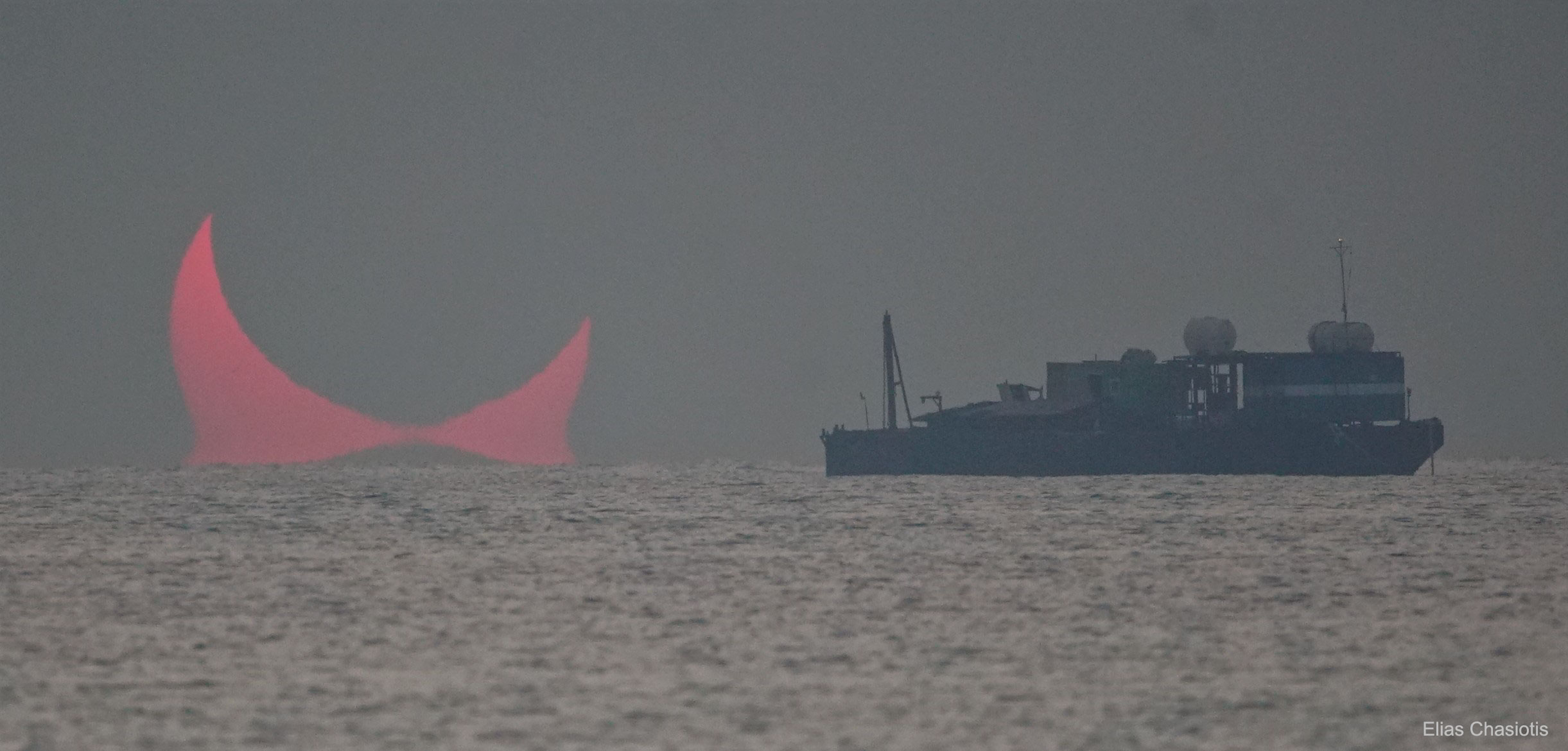 Yes, but have you ever seen a sunrise like this?  Here, after initial cloudiness, the Sun appeared to rise in two pieces and during a partial eclipse in 2019, causing the photographer to describe it as the most stunning sunrise of his life.  The dark circle near the top of the atmospherically-reddened Sun is the Moon -- but so is the dark peak just below it.  This is because along the way, the Earth's atmosphere had a layer of unusually warm air over the sea which acted like a gigantic lens and created a second image.  For a normal sunrise or sunset, this rare phenomenon of atmospheric optics is known as the Etruscan vase effect. The featured picture was captured in December 2019 from Al Wakrah, Qatar.  Some observers in a narrow band of Earth to the east were able to see a full annular solar eclipse -- where the Moon appears completely surrounded by the background Sun in a ring of fire.  The next solar eclipse, also an annular eclipse for well-placed observers, will occur this coming Saturday.   APOD editor to speak: in Houghton, Michigan on Thursday, October 12 at 6 pm