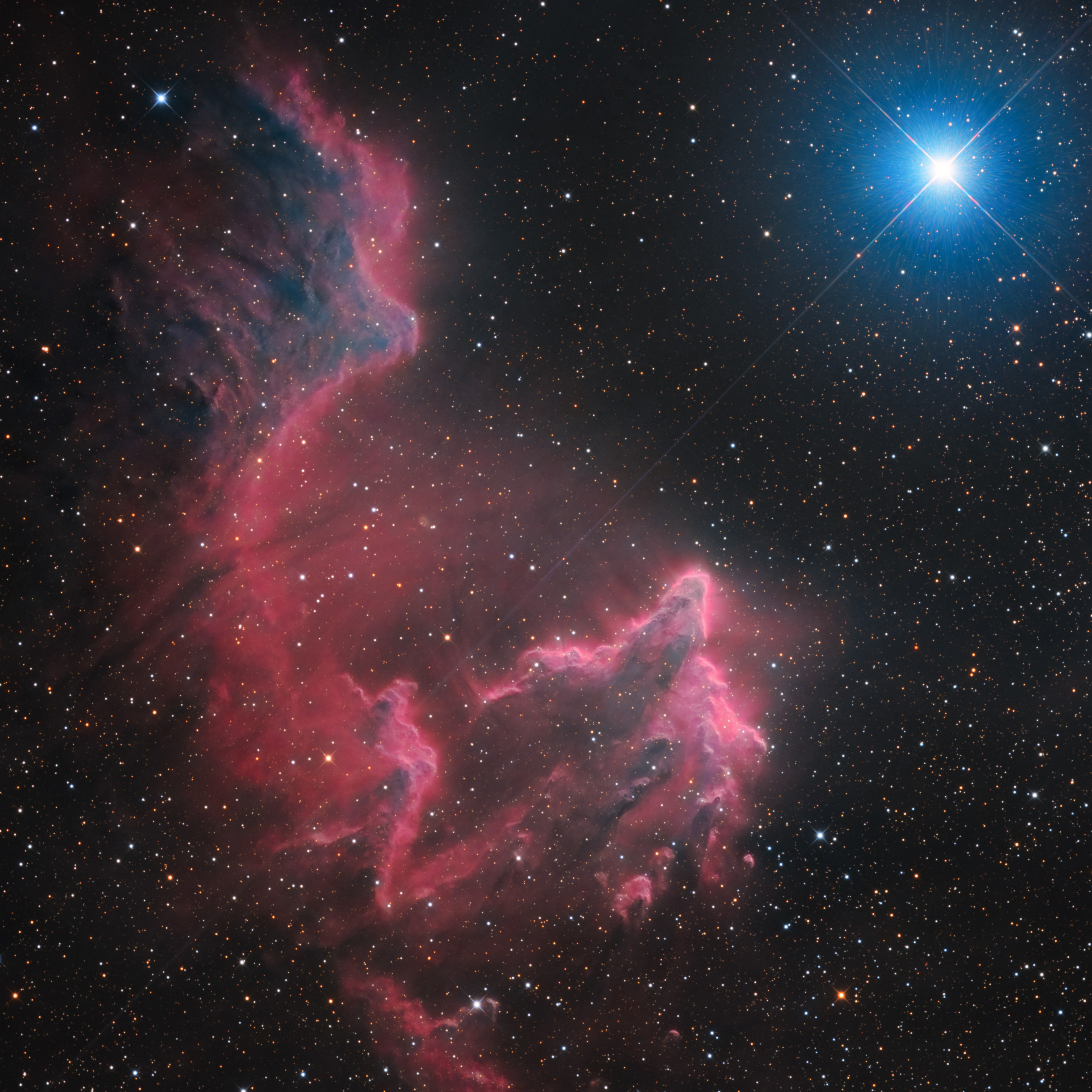 Gamma Cassiopeiae shines high in northern autumn evening skies. It's the brightest spiky star in this telescopic field of view toward the constellation Cassiopeia. Gamma Cas shares the ethereal-looking scene with ghostly interstellar clouds of gas and dust, IC 59 (top left) and IC 63.  About 600 light-years distant, the clouds aren't actually ghosts. They are slowly disappearing though, eroding under the influence of energetic radiation from hot and luminous gamma Cas. Gamma Cas is physically located only 3 to 4 light-years from the nebulae. Slightly closer to gamma Cas, IC 63 is dominated by red H-alpha light emitted as hydrogen atoms ionized by the star's ultraviolet radiation recombine with electrons. Farther from the star, IC 59 shows proportionally less H-alpha emission but more of the characteristic blue tint of dust reflected star light. The cosmic stage spans over 1 degree or 10 light-years at the estimated distance of gamma Cas and friends.