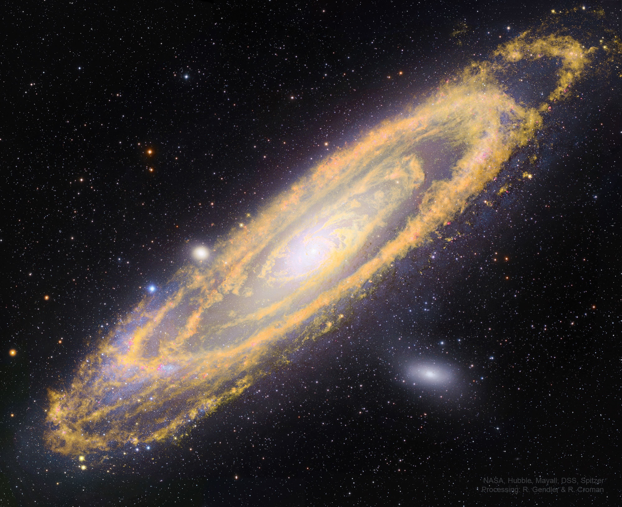 This picture of Andromeda shows not only where stars are now, but where stars will be. The big, beautiful Andromeda Galaxy, M31, is a spiral galaxy a mere 2.5 million light-years away.  Image data from space-based and ground-based observatories have been combined here to produce this intriguing composite view of Andromeda at wavelengths both inside and outside normally visible light. The visible light shows where M31's stars are now, highlighted in white and blue hues and imaged by the Hubble, Subaru, and Mayall telescopes.  The infrared light shows where M31's future stars will soon form, highlighted in orange hues and imaged by NASA's Spitzer Space Telescope.  The infrared light tracks enormous lanes of dust, warmed by stars, sweeping along Andromeda's spiral arms.  This dust is a tracer of the galaxy's vast interstellar gas, raw material for future star formation.  Of course, the new stars will likely form over the next hundred million years or so. That's well before Andromeda merges with our Milky Way Galaxy in about 5 billion years.