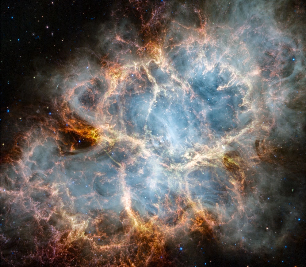 Cataloged as M1, the Crab Nebula is the first on Charles Messier's famous list of things which are not comets. In fact, the Crab Nebula is now known to be a supernova remnant, an expanding cloud of debris from the death explosion of a massive star. The violent birth of the Crab was witnessed by astronomers in the year 1054. Roughly 10 light-years across, the nebula is still expanding at a rate of about 1,500 kilometers per second. You can see the expansion by comparing these sharp images from the Hubble Space Telescope and James Webb Space Telescope. The Crab's dynamic, fragmented filaments were captured in visible light by Hubble in 2005 and Webb in infrared light in 2023. This cosmic crustacean lies about 6,500 light-years away in the constellation Taurus.