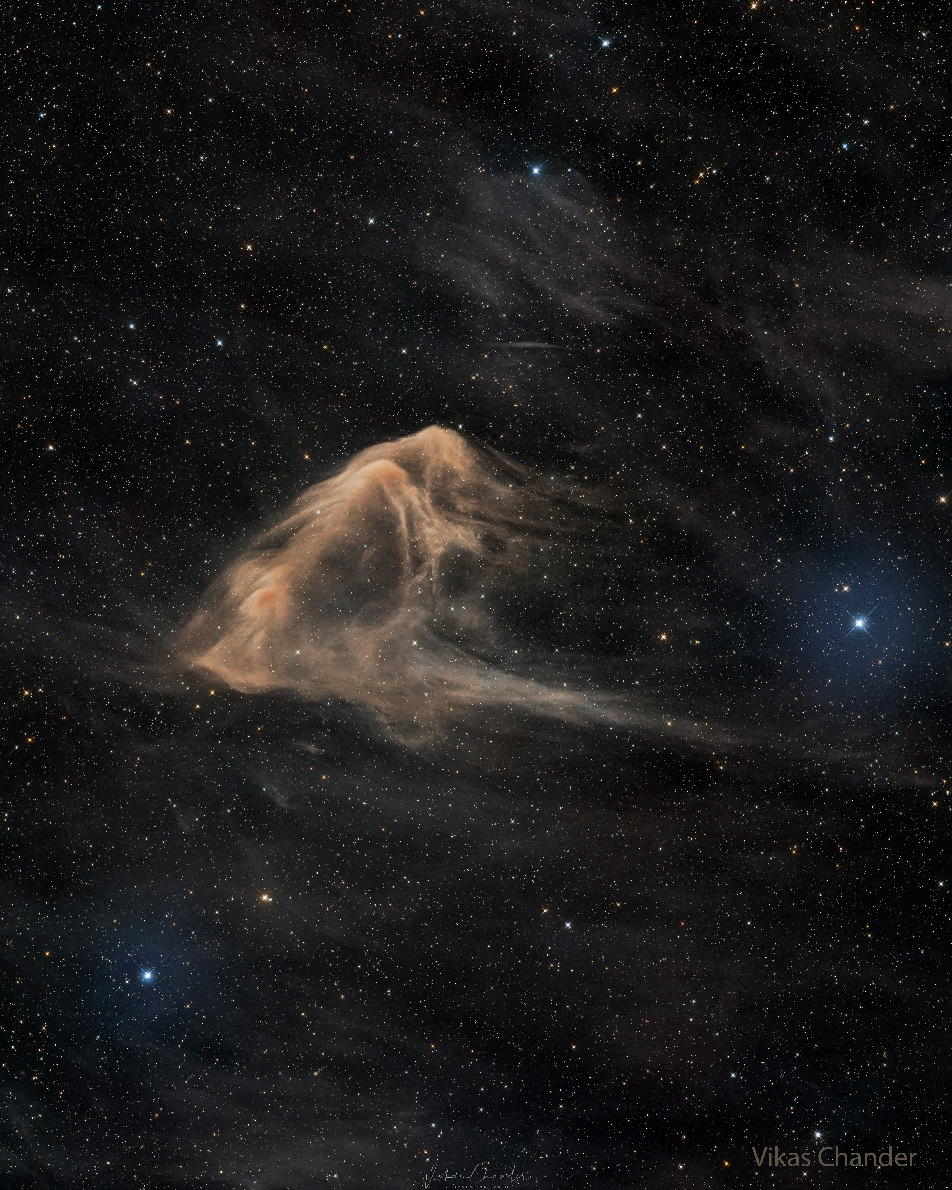 This eagle ray glides across a cosmic sea.  Officially cataloged as SH2-63 and LBN 86, the dark nebula is composed of gas and dust that just happens to appear shaped like a common ocean fish.  The interstellar dust nebula appears light brown as it blocks and reddens visible light emitted behind it. Dark nebulas glow primarily in infrared light, but also reflect visible light from surrounding stars. The dust in dark nebulas is usually sub-millimeter chunks of carbon, silicon, and oxygen, frequently coated with frozen carbon monoxide and nitrogen.  Dark nebulas are also known as molecular clouds because they also contain relatively high amounts of molecular hydrogen and larger molecules. Previously unnamed, the here dubbed Eagle Ray Nebula is normally quite dim but has been imaged clearly over 20-hours through dark skies in Chile.    Follow APOD on: Discord