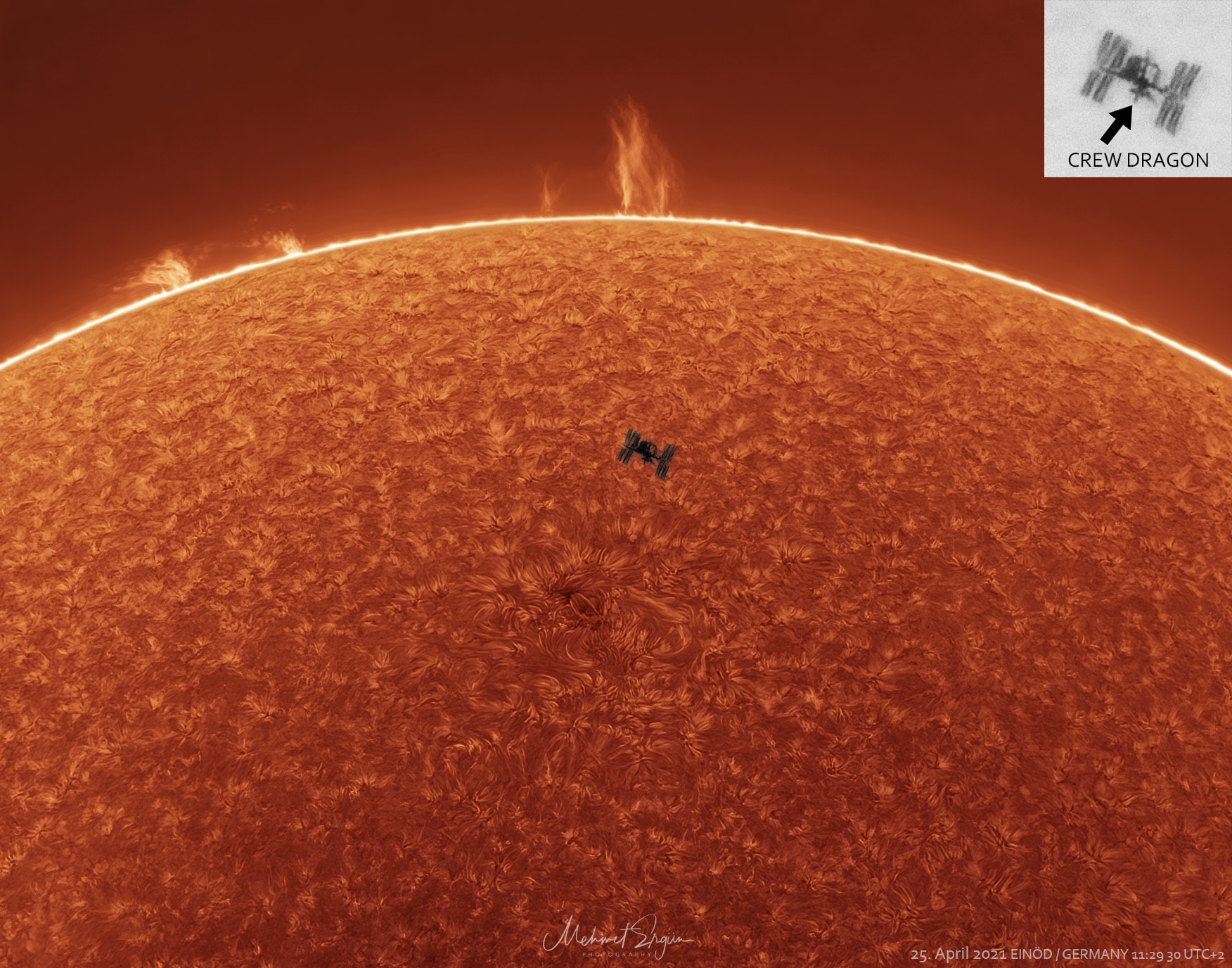 That's no sunspot. It's the International Space Station (ISS) caught passing in front of the Sun. Sunspots, individually, have a dark central umbra, a lighter surrounding penumbra, and no Dragon capsules attached.  By contrast, the ISS is a complex and multi-spired mechanism, one of the largest and most complicated spacecraft ever created by humanity.  Also, sunspots circle the Sun, whereas the ISS orbits the Earth.  Transiting the Sun is not very unusual for the ISS, which orbits the Earth about every 90 minutes, but getting one's location, timing and equipment just right for a great image is rare.  The featured picture combined three images all taken in 2021 from the same location and at nearly the same time. One image -- overexposed -- captured the faint prominences seen across the top of the Sun, a second image -- underexposed -- captured the complex texture of the Sun's chromosphere, while the third image -- the hardest to get -- captured the space station as it shot across the Sun in a fraction of a second.  Close inspection of the space station's silhouette even reveals a docked Dragon Crew capsule.   Follow APOD on Instagram in: Arabic, English, Persian, Portuguese, and Taiwanese