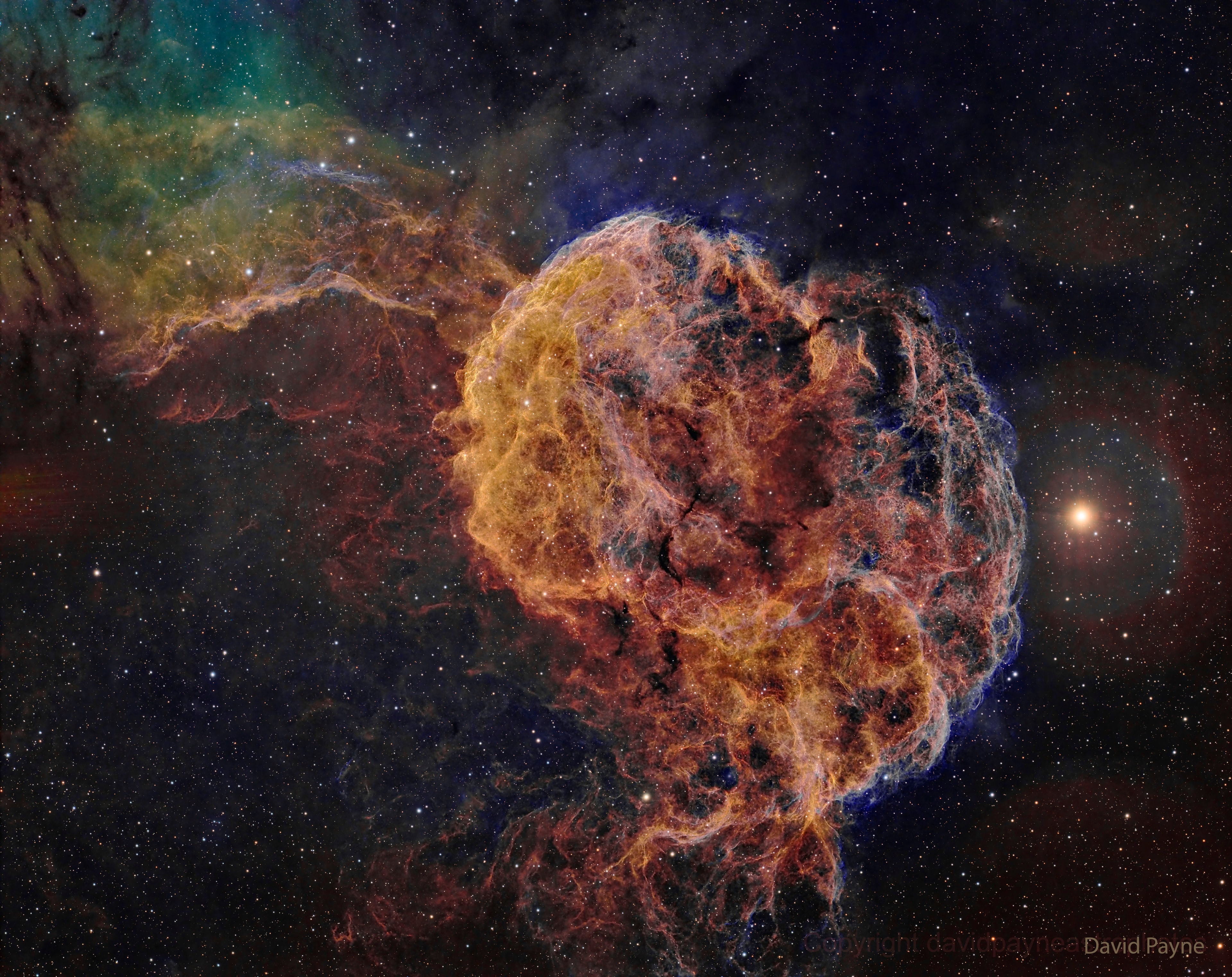 Why is this jellyfish swimming in a sea of stars? Drifting near bright star Eta Geminorum, seen at the right, the Jellyfish Nebula extends its tentacles from the bright arcing ridge of emission left of center.  In fact, the cosmic jellyfish is part of bubble-shaped supernova remnant IC 443, the expanding debris cloud from a massive star that exploded.  Light from the explosion first reached planet Earth over 30,000 years ago.  Like its cousin in astronomical waters, the Crab Nebula supernova remnant IC 443 is known to harbor a neutron star -- the remnant of the collapsed stellar core.  The Jellyfish Nebula is about 5,000 light-years away.  At that distance, the featured image would span about 140 light-years across.   Your Sky Surprise: What picture did APOD feature on your birthday? (post 1995)