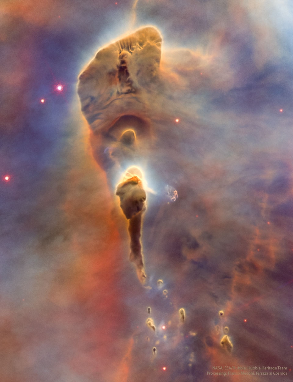 It's stars versus dust in the Carina Nebula and the stars are winning. More precisely, the energetic light and winds from massive newly formed stars are evaporating and dispersing the dusty stellar nurseries in which they formed. Located in the Carina Nebula and inside a region known informally as Mystic Mountain, these pillars' appearance is dominated by opaque brown dust even though it is composed mostly of clear hydrogen gas. Even though some of the dust pillars look like torches, their ends are not on fire -- rather, they are illuminated by nearby stars.  About 7,500 light-years distant, the featured image was taken with the Hubble Space Telescope and highlights an interior region of Carina known as HH1066 which spans nearly a  light year. Within a few million years, the stars will likely win out completely and the dust torches will completely evaporate.