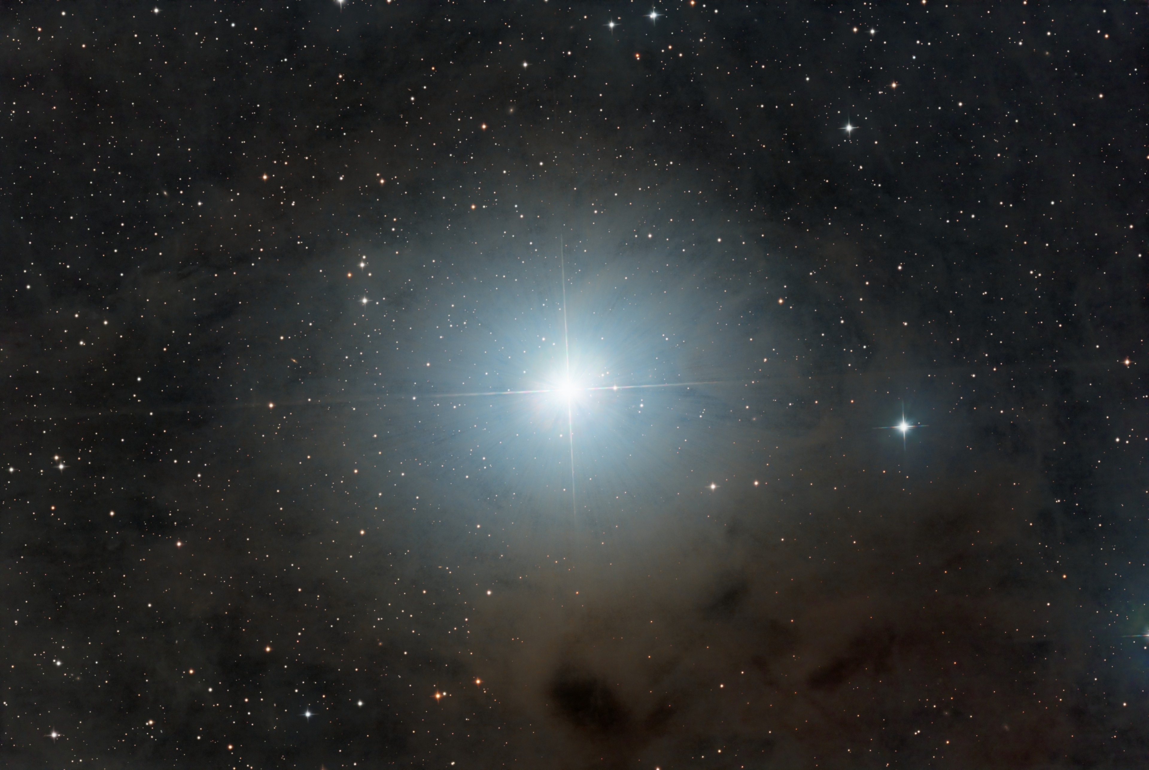 silon Tauri lies 146 light-years away. A K-type red giant star, epsilon Tau is cooler than the Sun, but with about 13 times the solar radius it shines with nearly 100 times the solar luminosity. A member of the Hyades open star cluster the giant star is known by the proper name Ain, and along with brighter giant star Aldebaran, forms the eyes of Taurus the Bull. Surrounded by dusty, dark clouds in Taurus, epsilon Tau is also known to have a planet. Discovered by radial velocity measurements in 2006, epsilon Tauri b is a gas giant planet larger than Jupiter with an orbital period of 1.6 years. And though the exoplanet can't be seen directly, on a dark night its parent star epsilon Tauri is easily visible to the unaided eye.